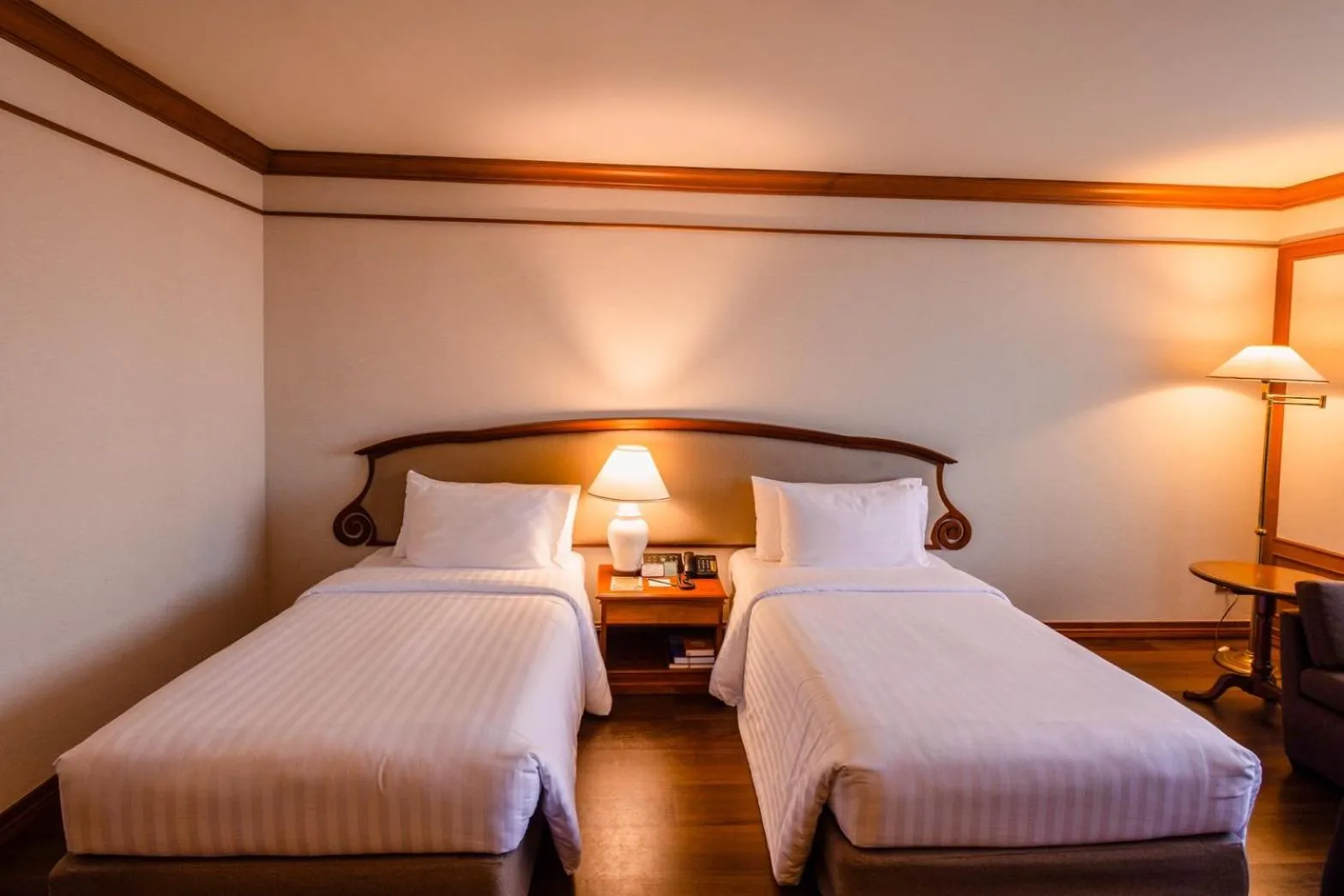 Bed in The Twin Lotus Hotel