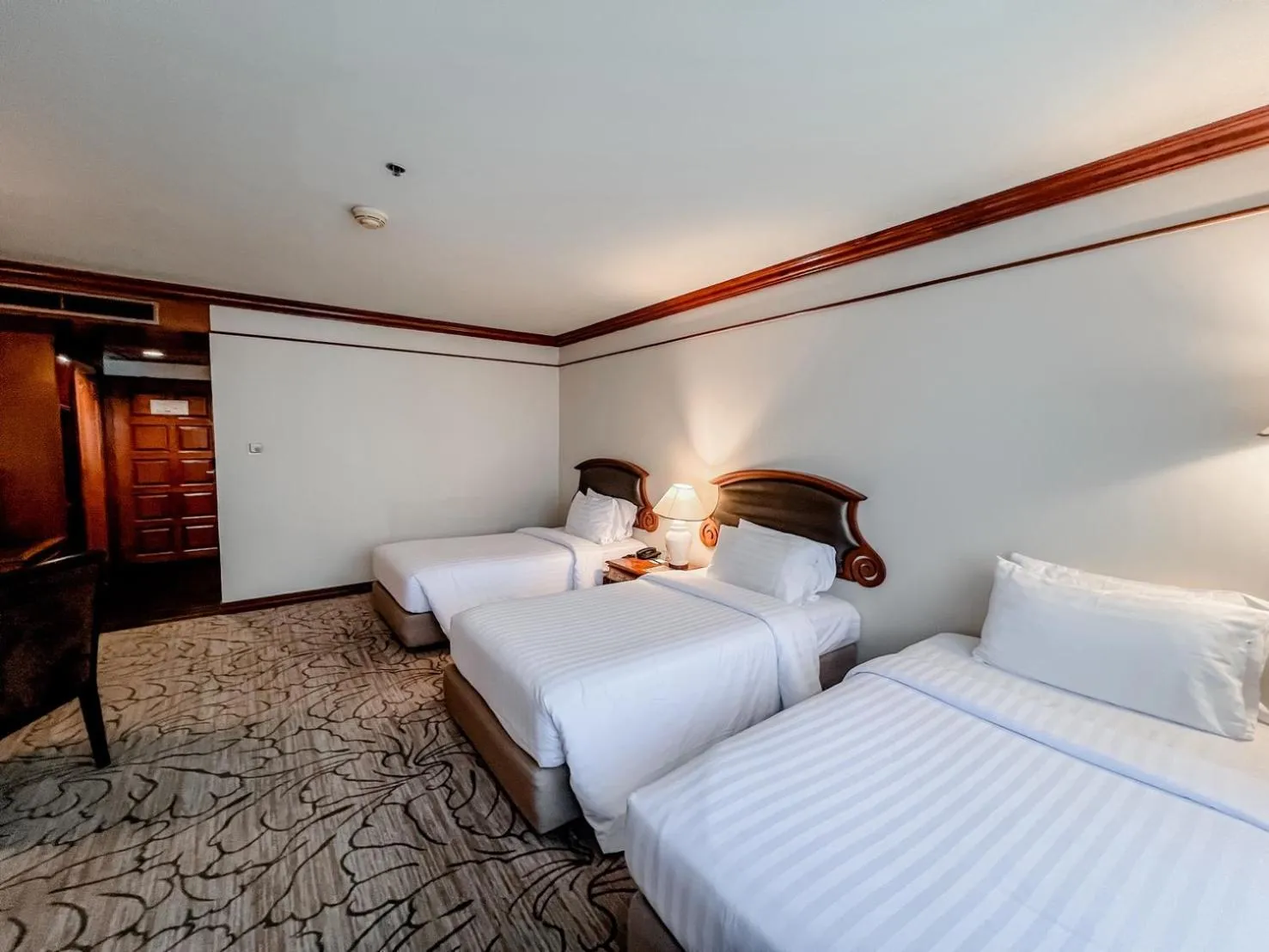 Bed in The Twin Lotus Hotel