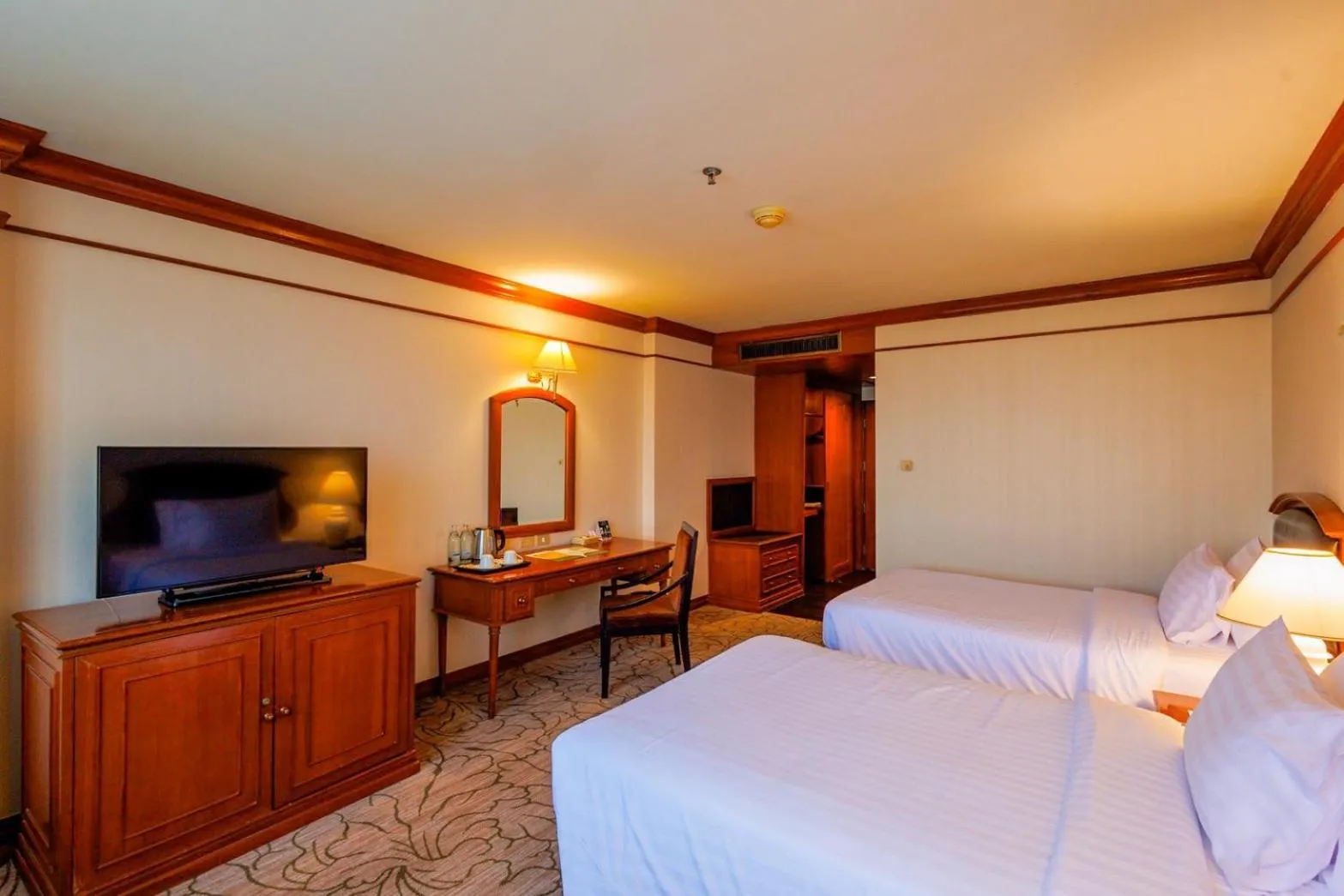 Bed in The Twin Lotus Hotel