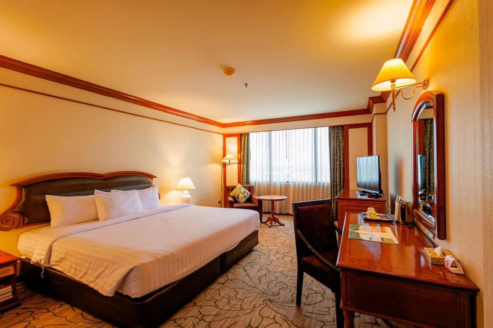 Bed in The Twin Lotus Hotel