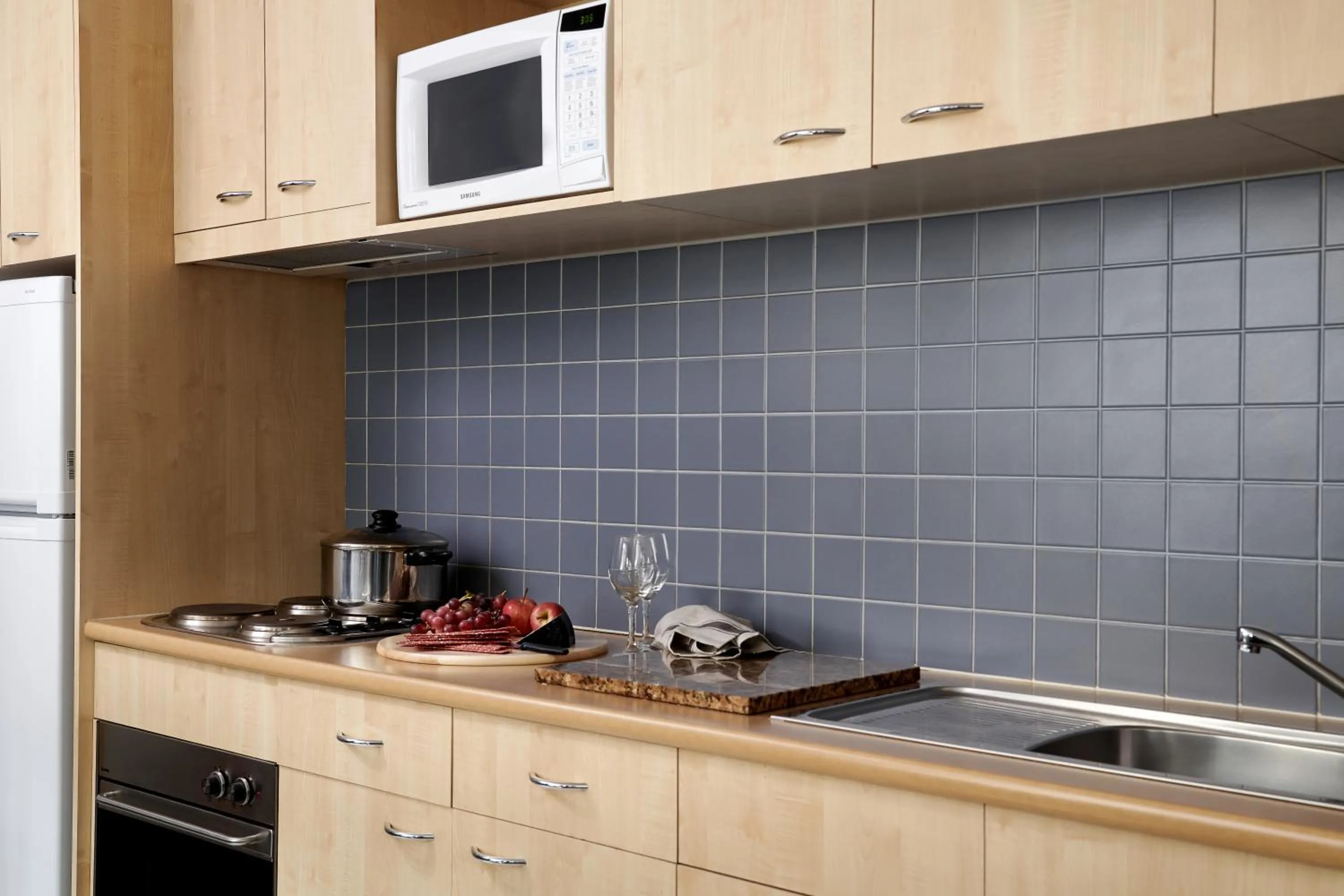 Kitchen or kitchenette in Punthill Apartment Hotel - Flinders Lane