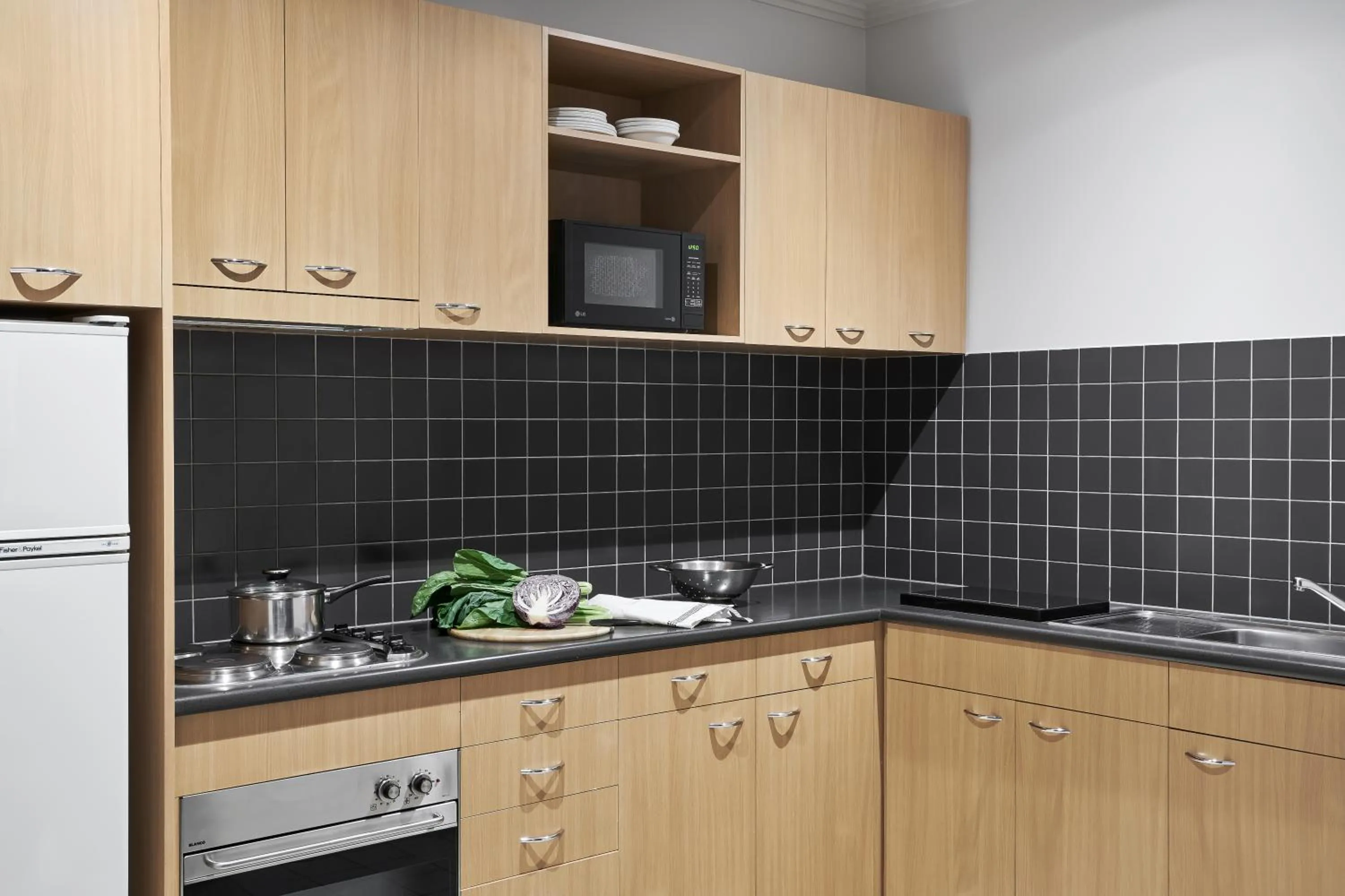 Kitchen or kitchenette in Punthill Apartment Hotel - Flinders Lane