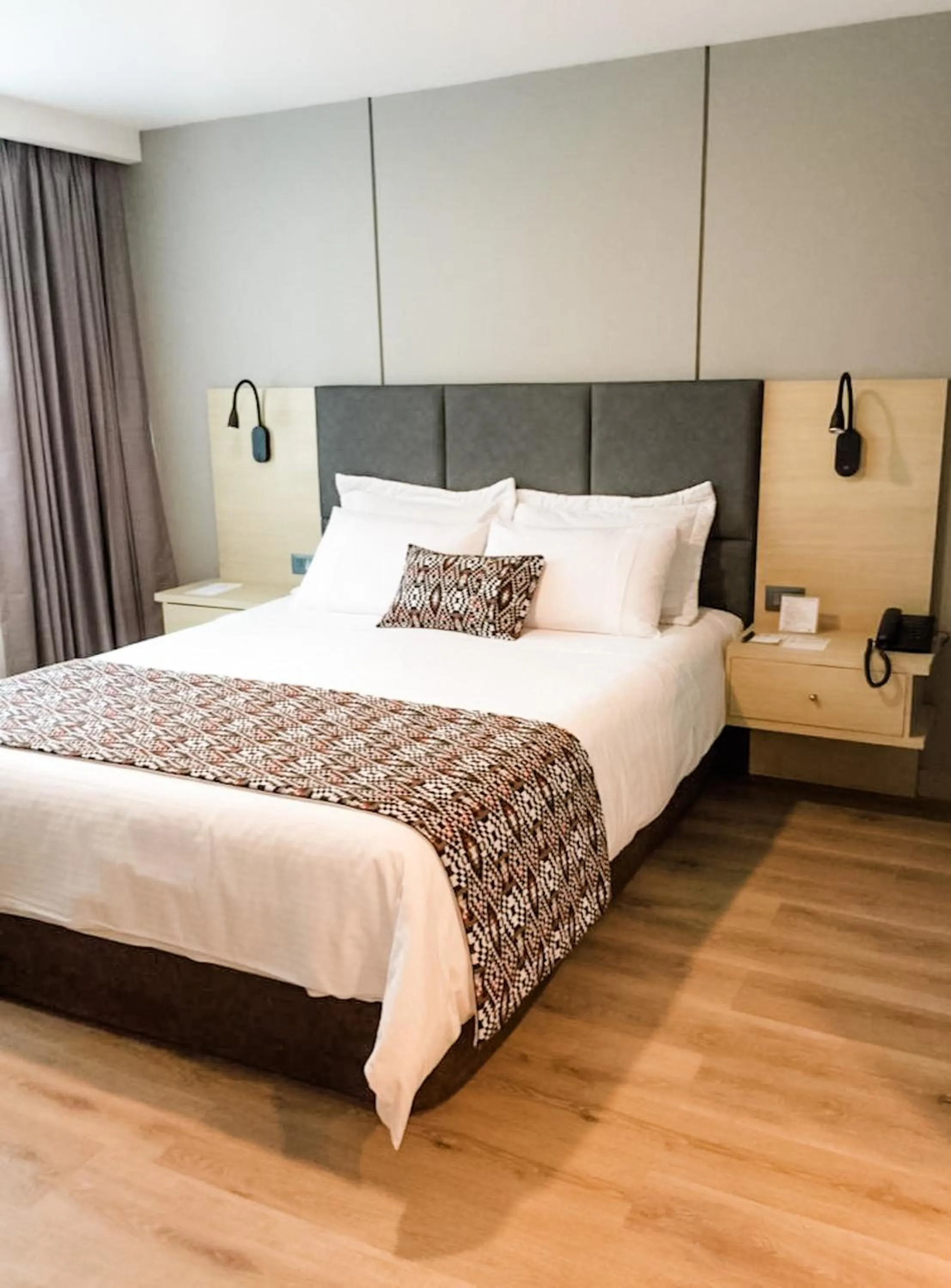 Bed in Novelty Suites Hotel - Oviedo Mall