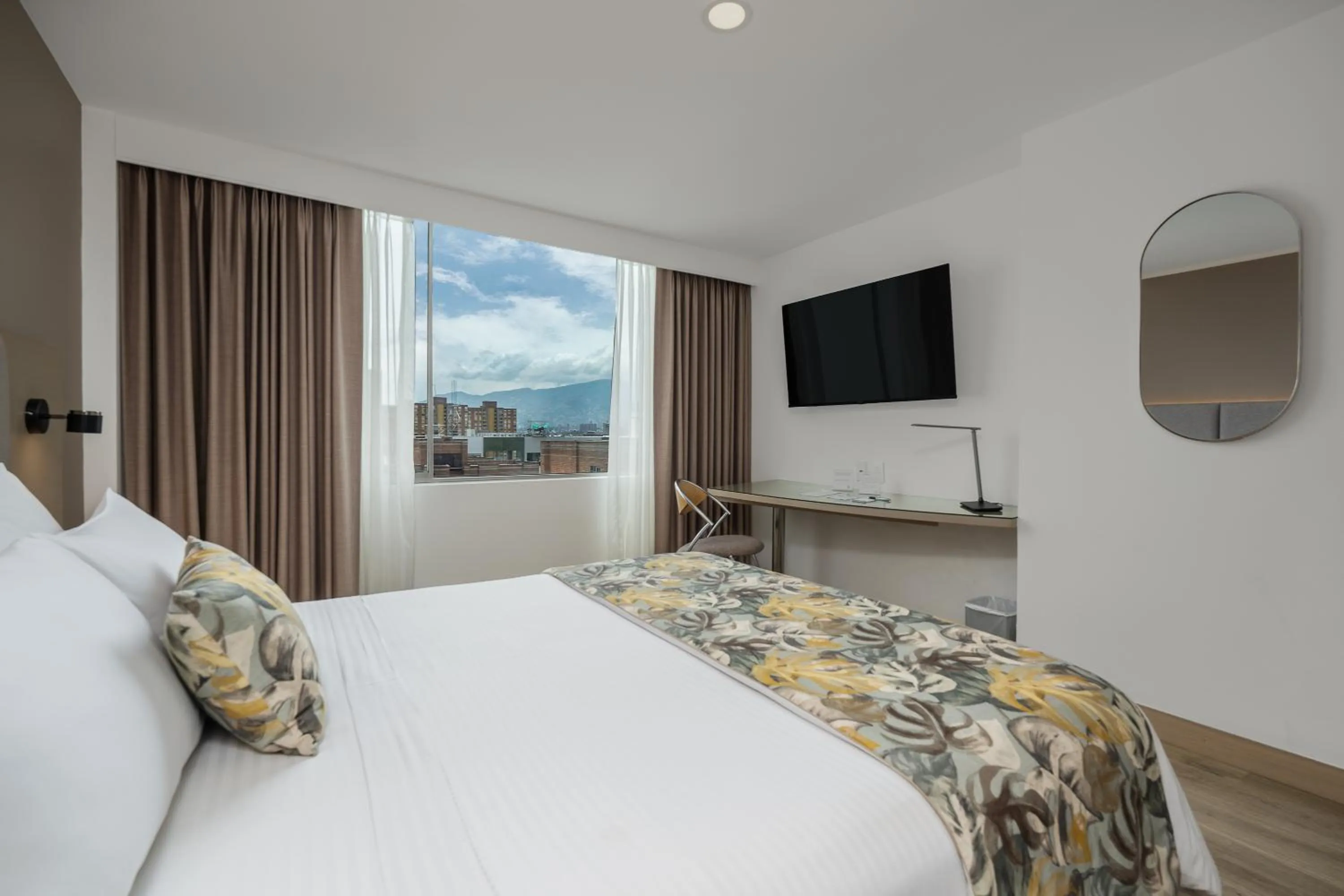 Bed in Novelty Suites Hotel - Oviedo Mall