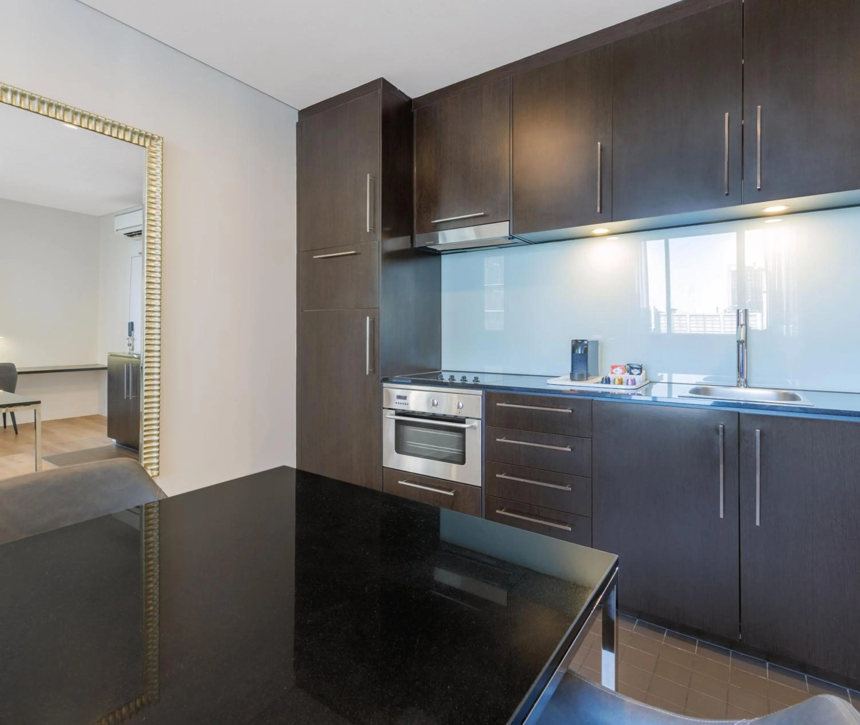 Kitchen or kitchenette in Oaks Melbourne on Collins Suites