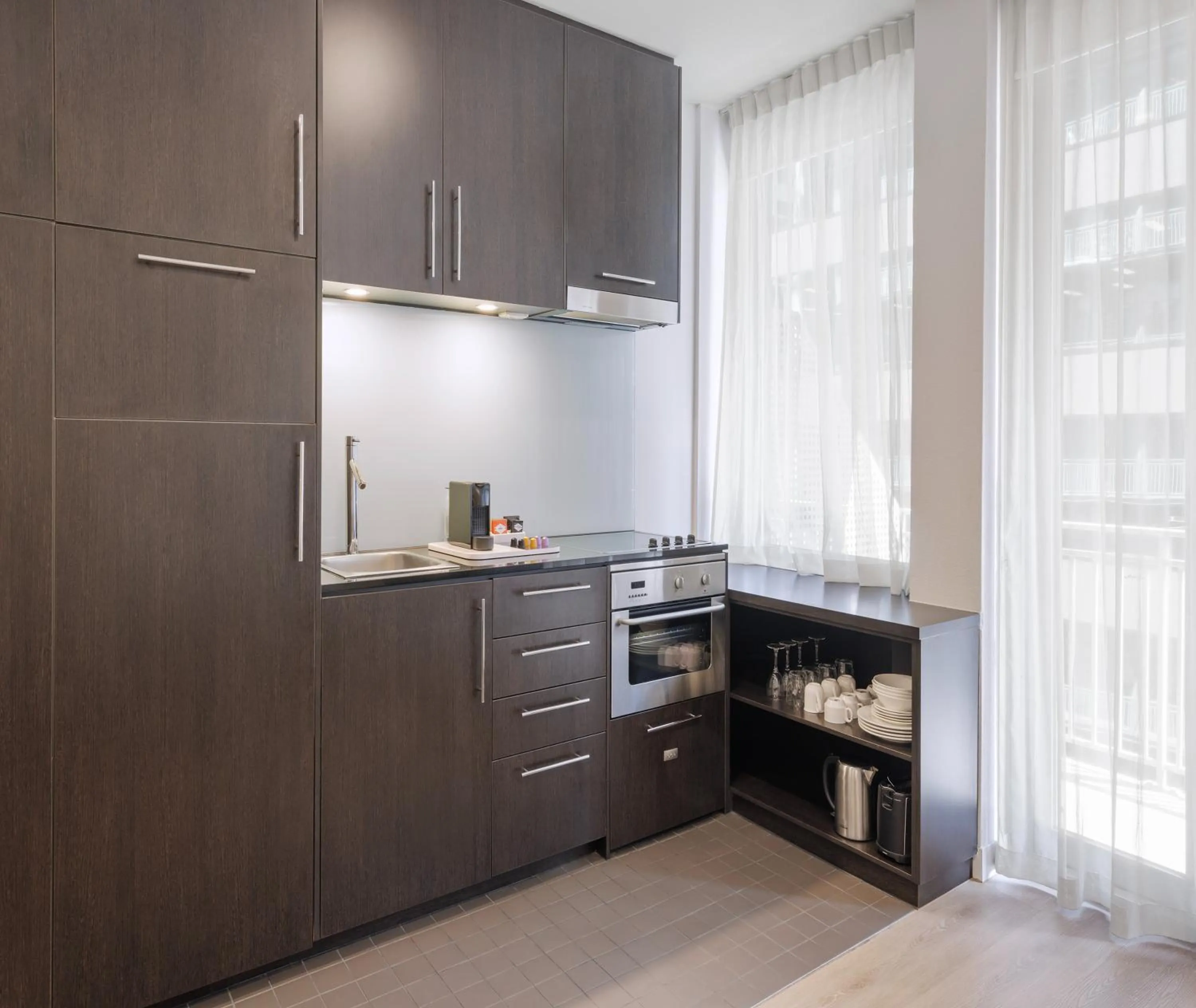 Kitchen or kitchenette in Oaks Melbourne on Collins Suites