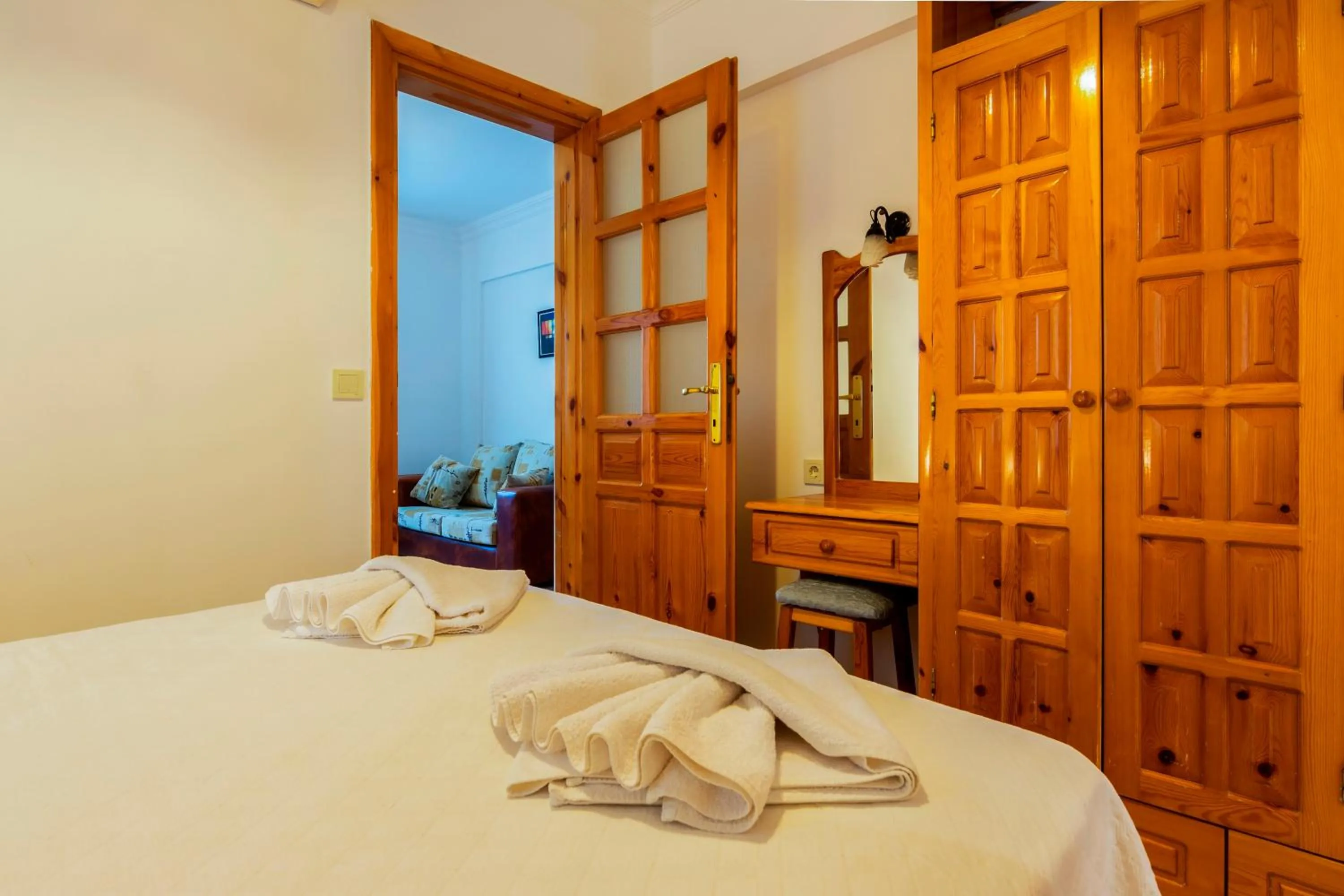 Bed in Calypso Cozy Suites