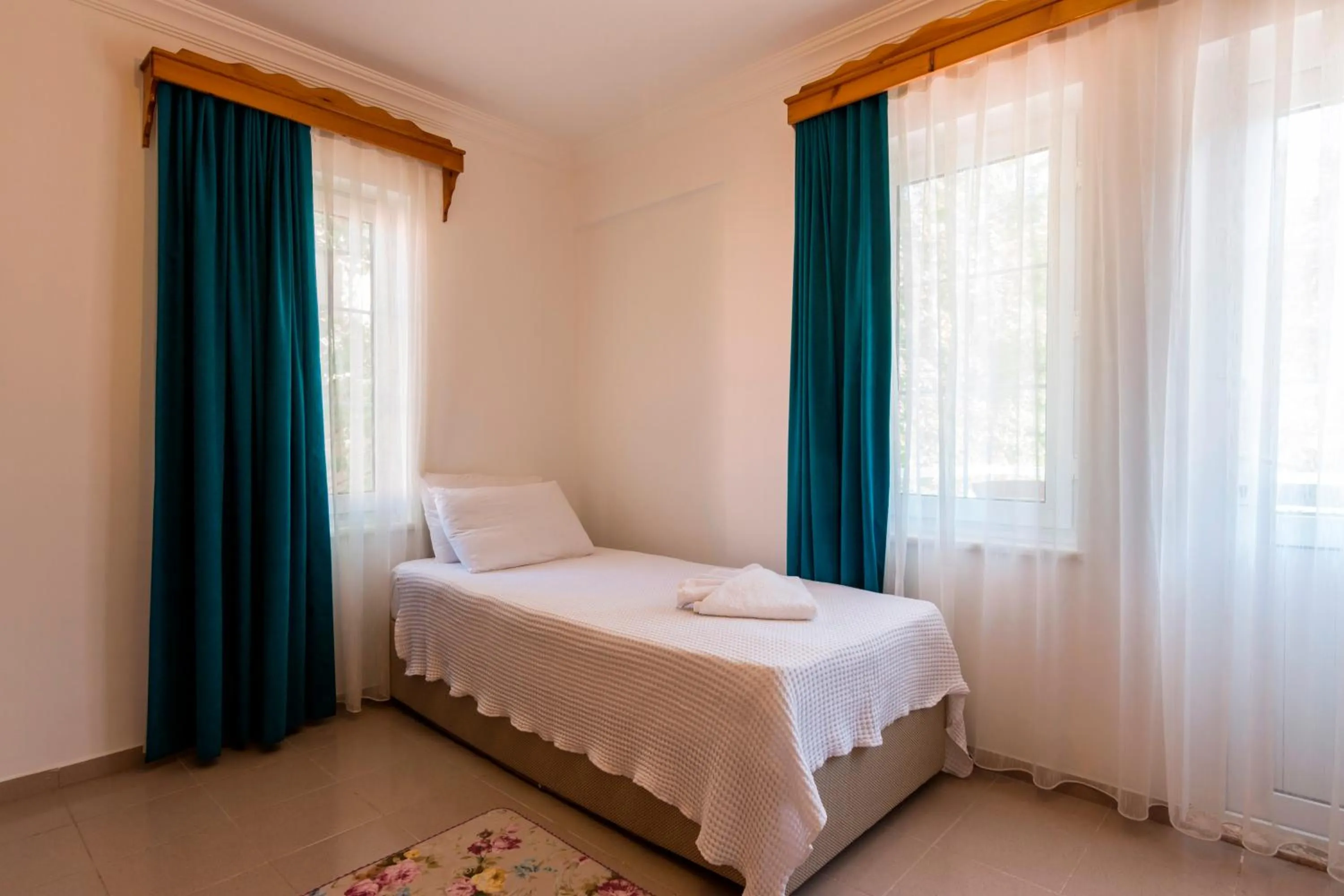 Living room, Bed in Calypso Cozy Suites