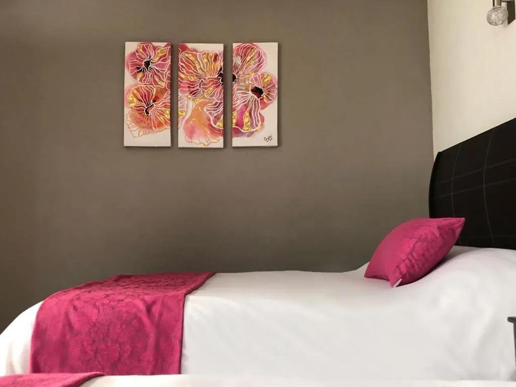 Bed in Hotel Bugambilias Rooms