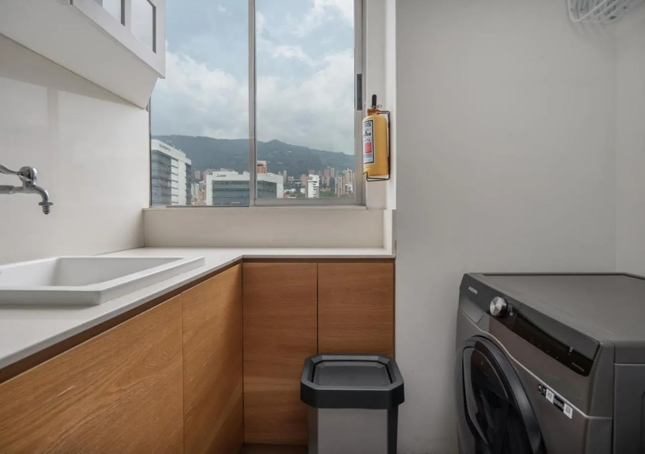 washing machine in Affinity ApartaHotel - Extended Stay