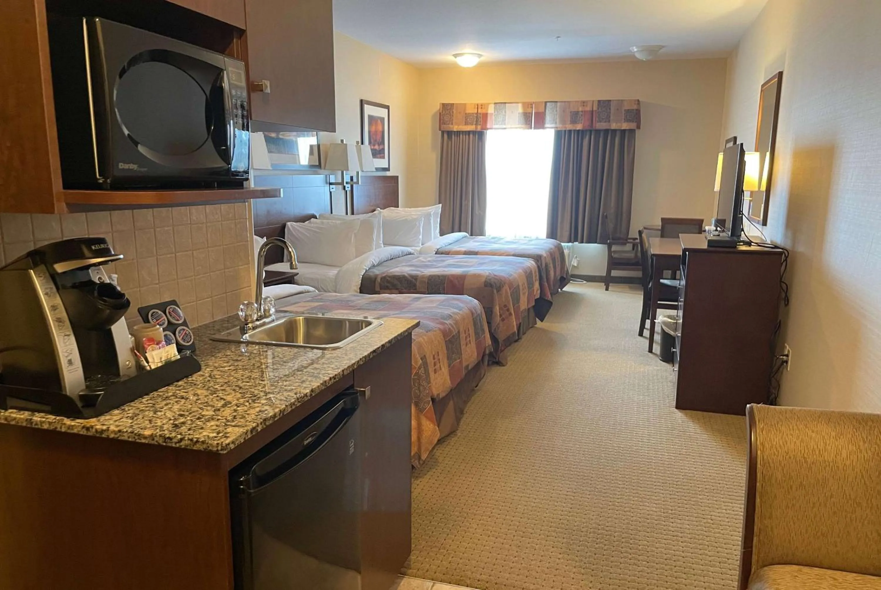 Photo of the whole room in Ramada by Wyndham High River