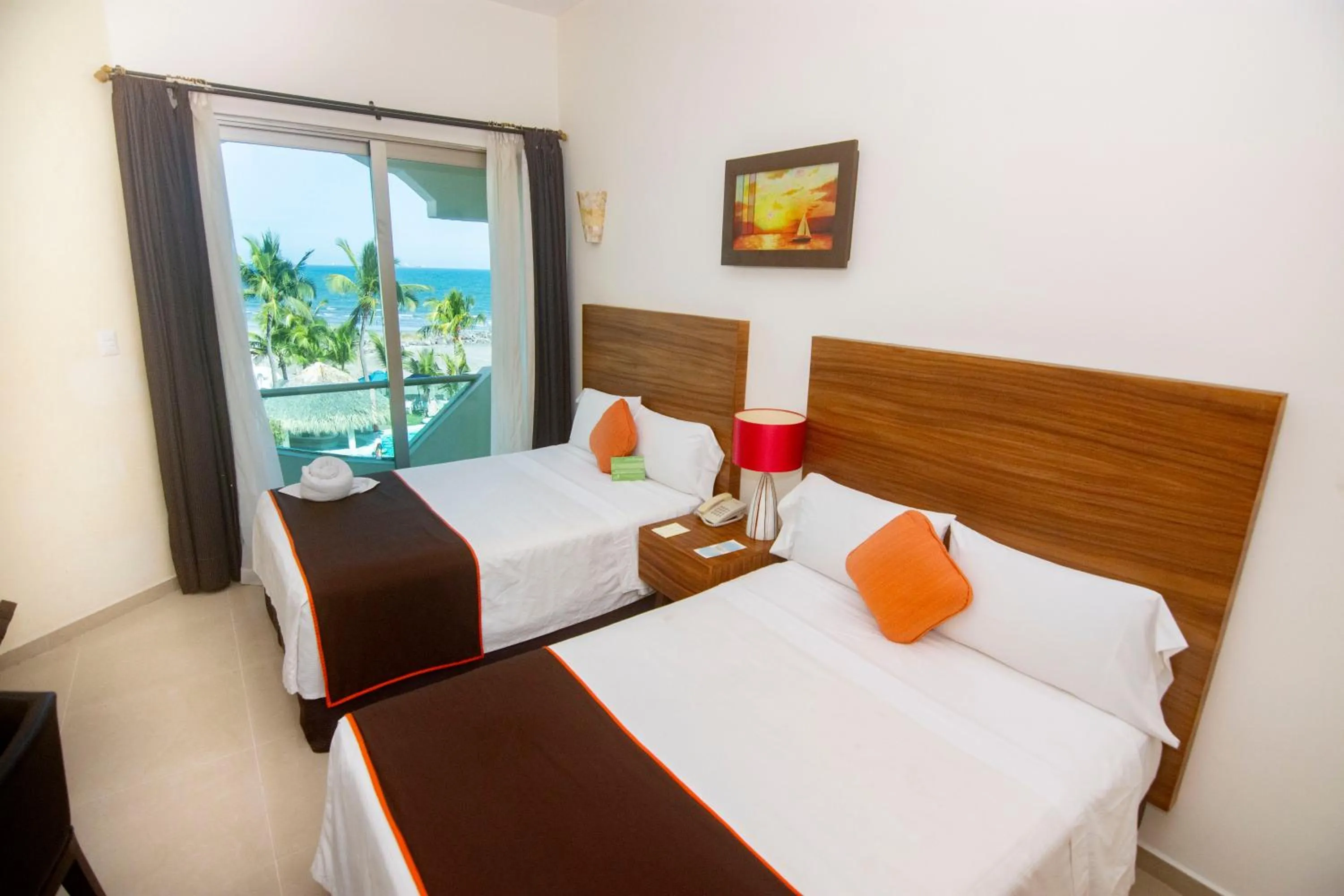 Photo of the whole room, Bed in Playa Caracol Hotel & Spa