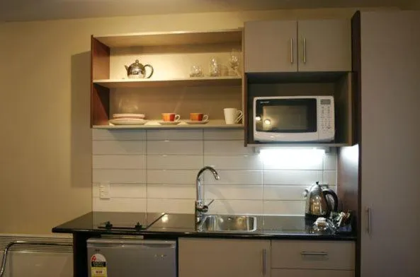 Kitchen or kitchenette in Athena Motel