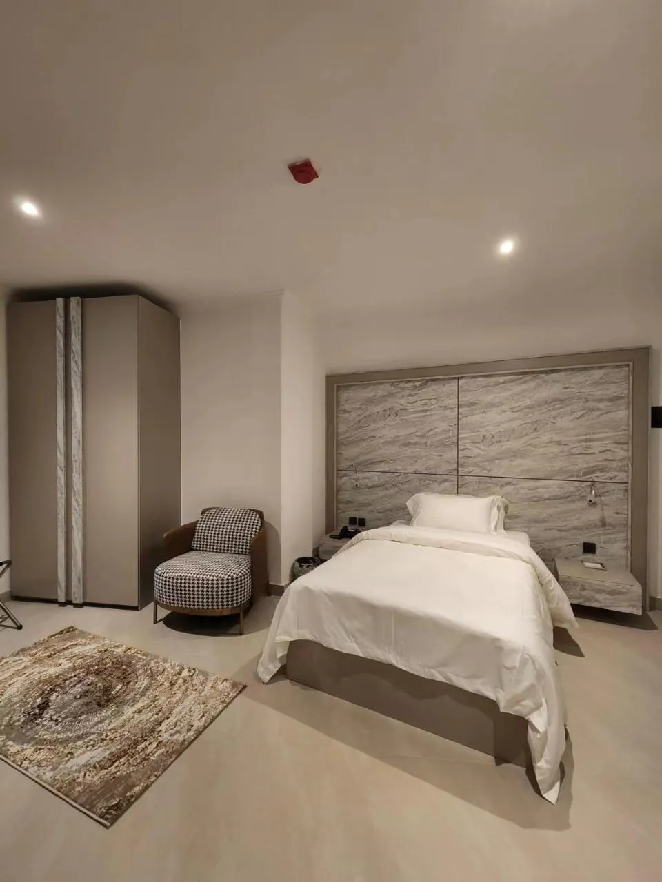 Bed in Imperial Suites Hotel