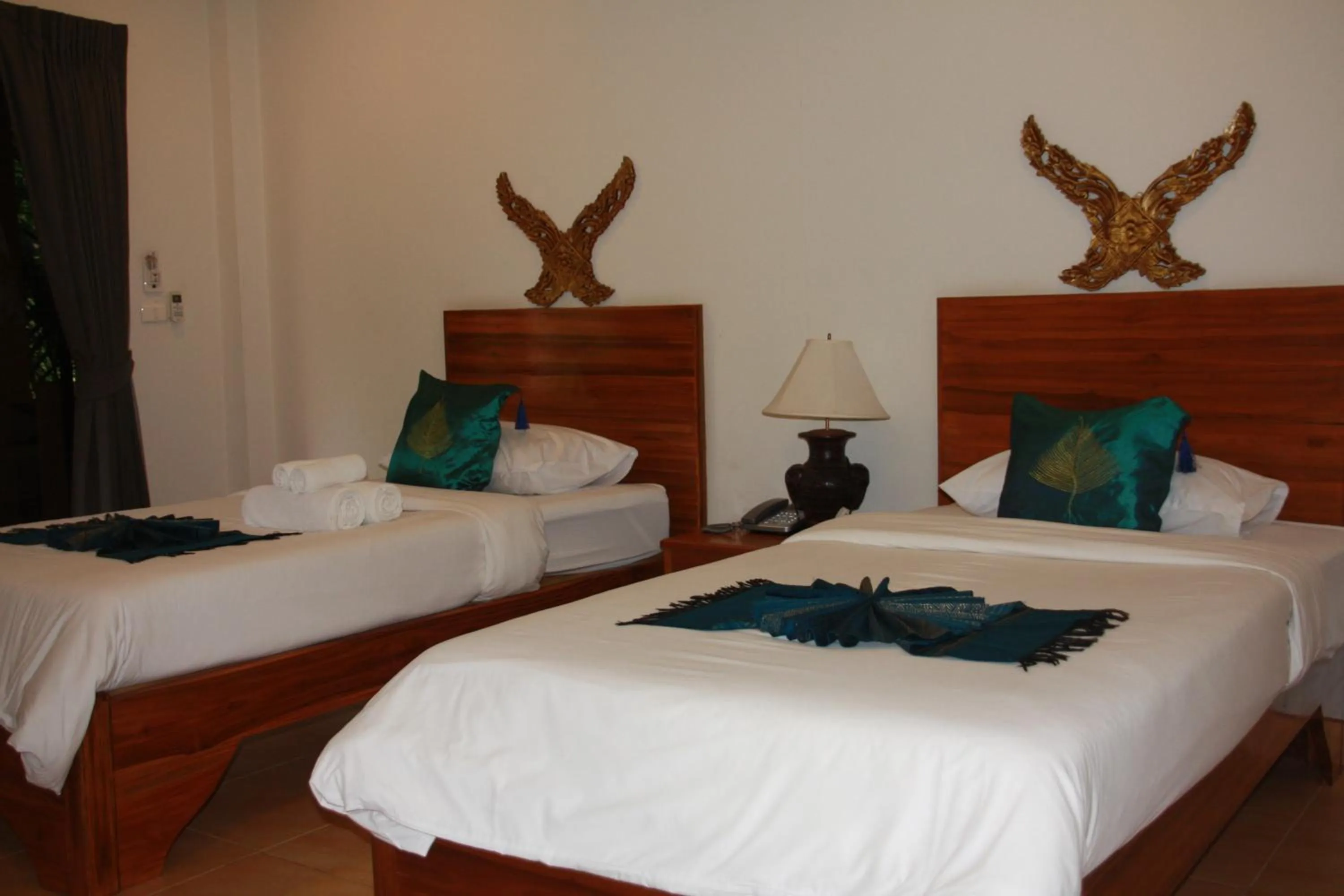 Bed in Baan Vanida Garden Resort