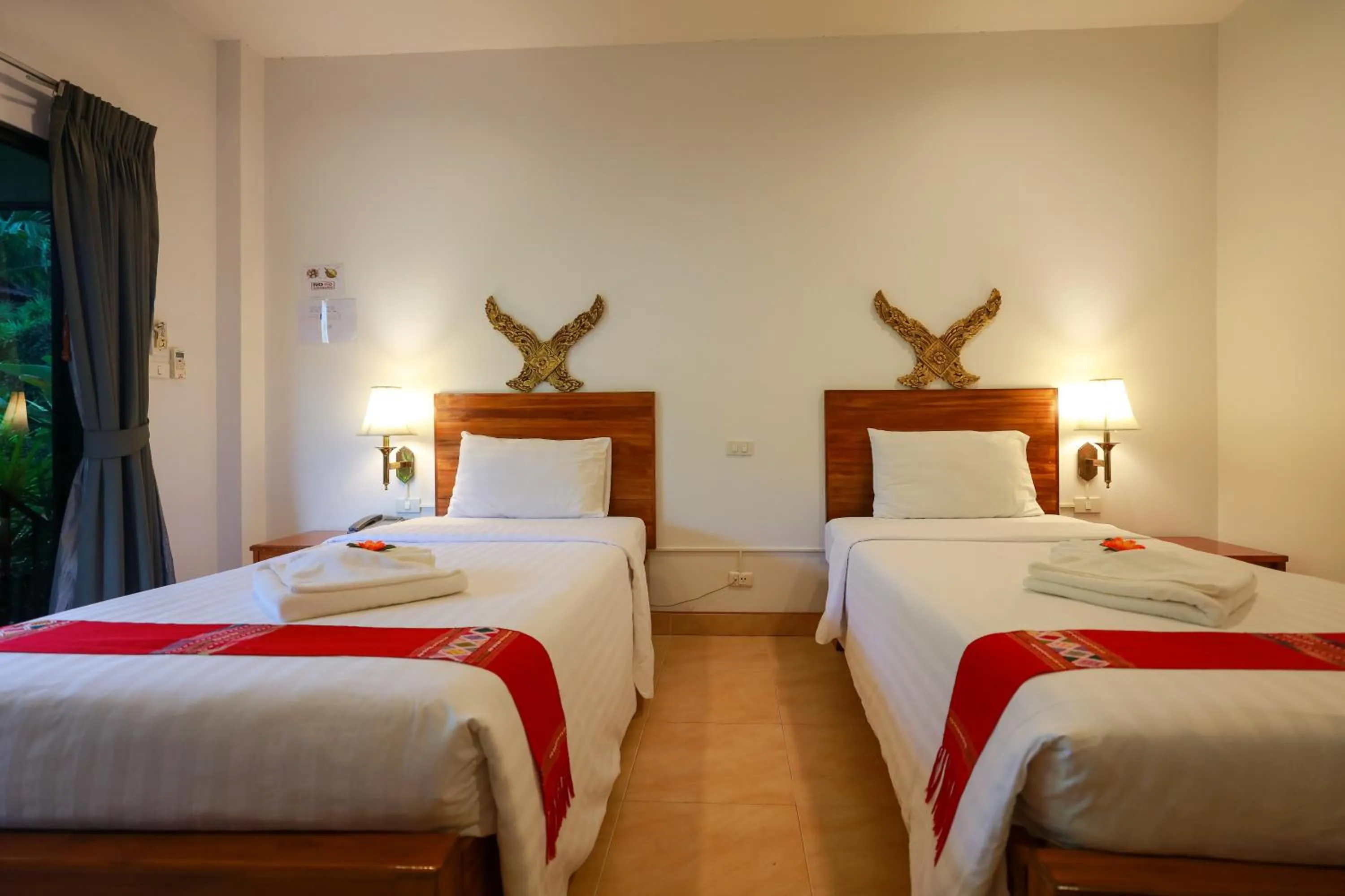 Bed in Baan Vanida Garden Resort