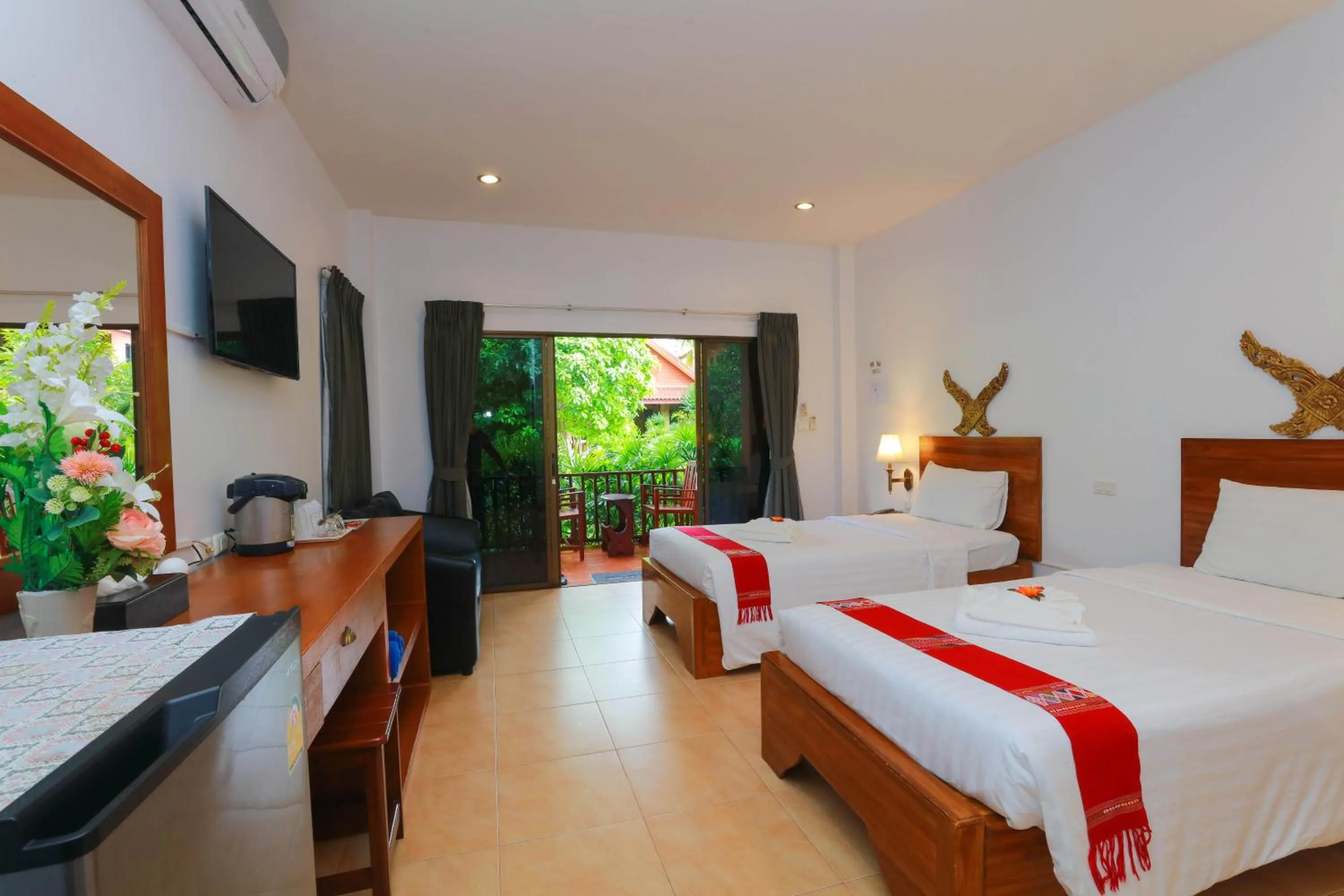 Bed in Baan Vanida Garden Resort