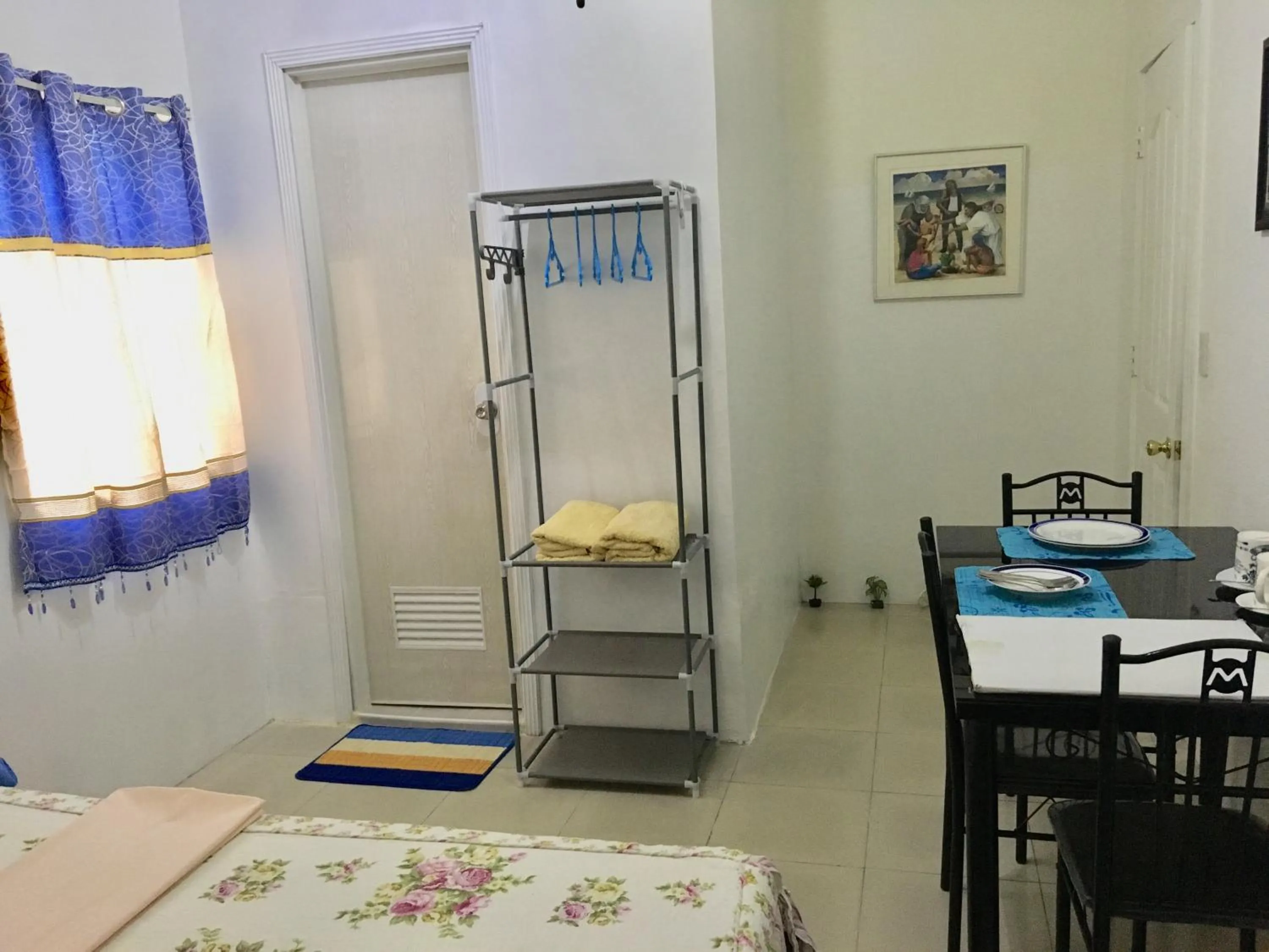 Bed in Blue Summer Suites & Restaurant