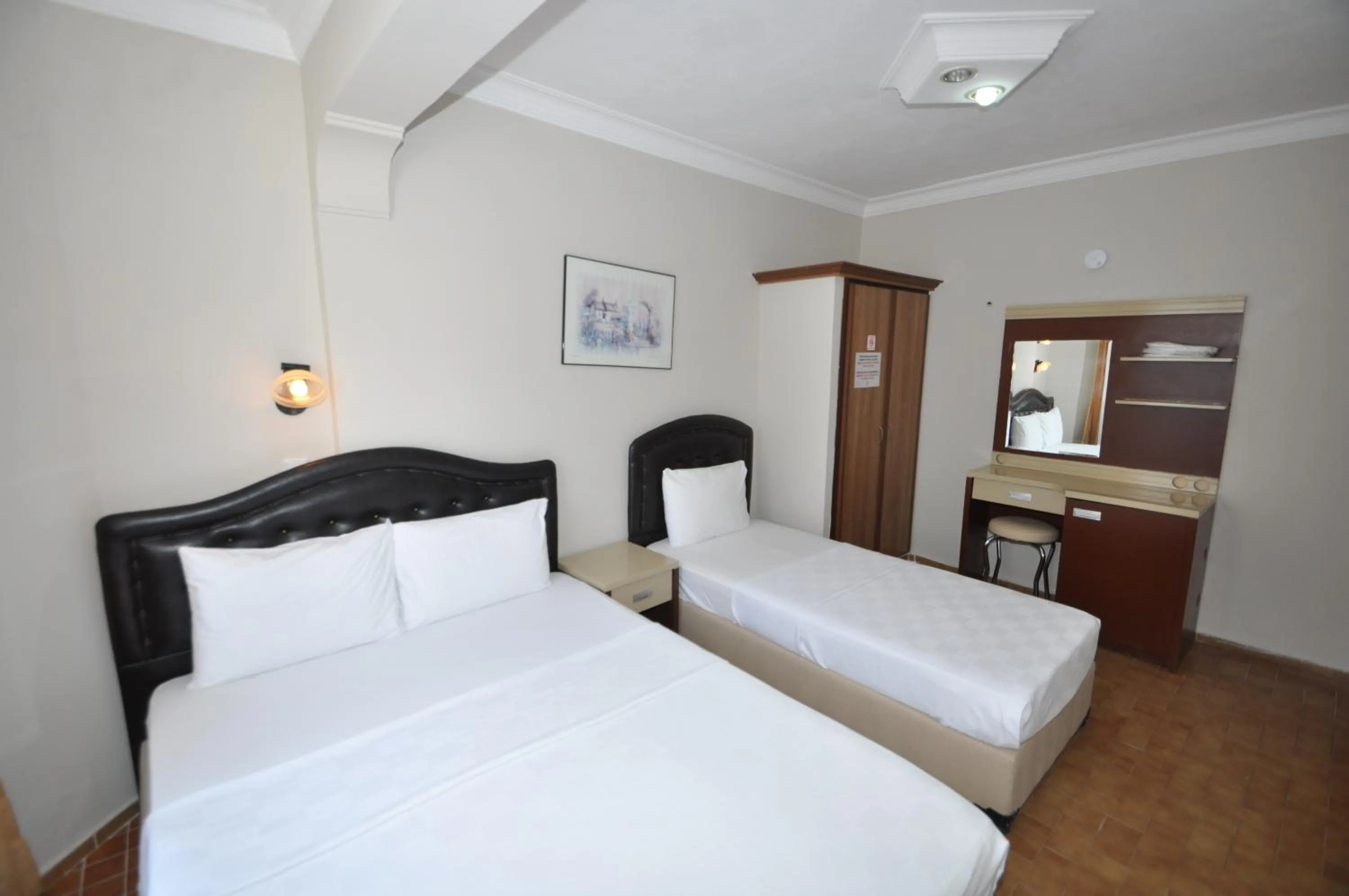 Bed in Defne & Zevkim Hotel