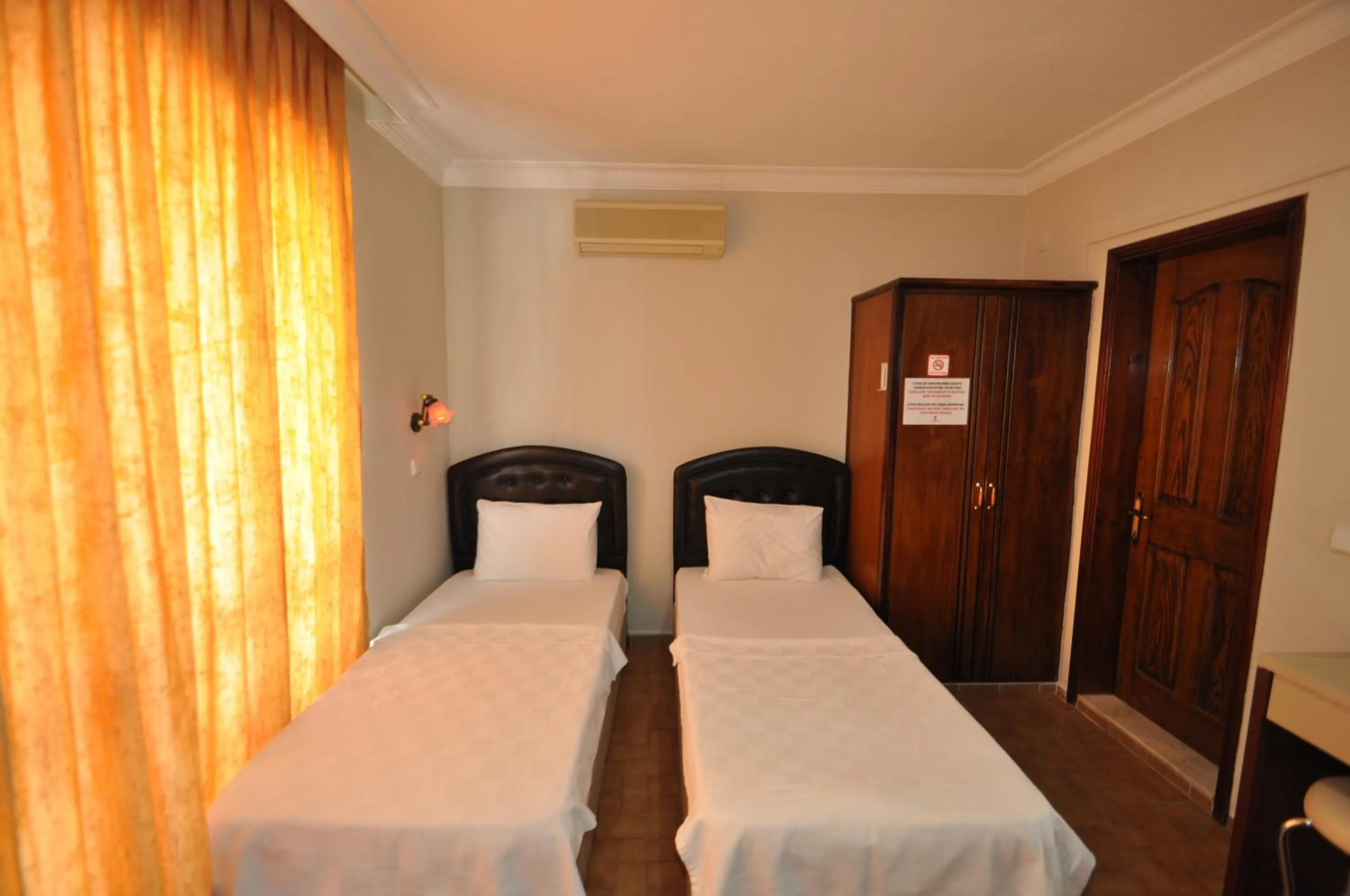 Bed in Defne & Zevkim Hotel
