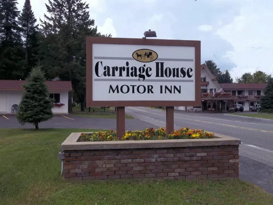 Property logo or sign in Carriage House Motor Inn