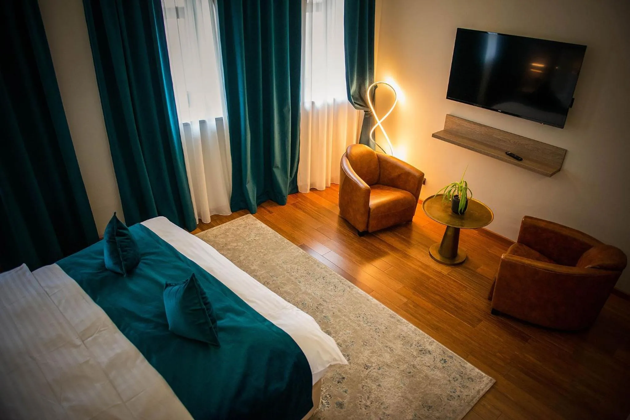 Seating area, Bed in Casa Hrisicos