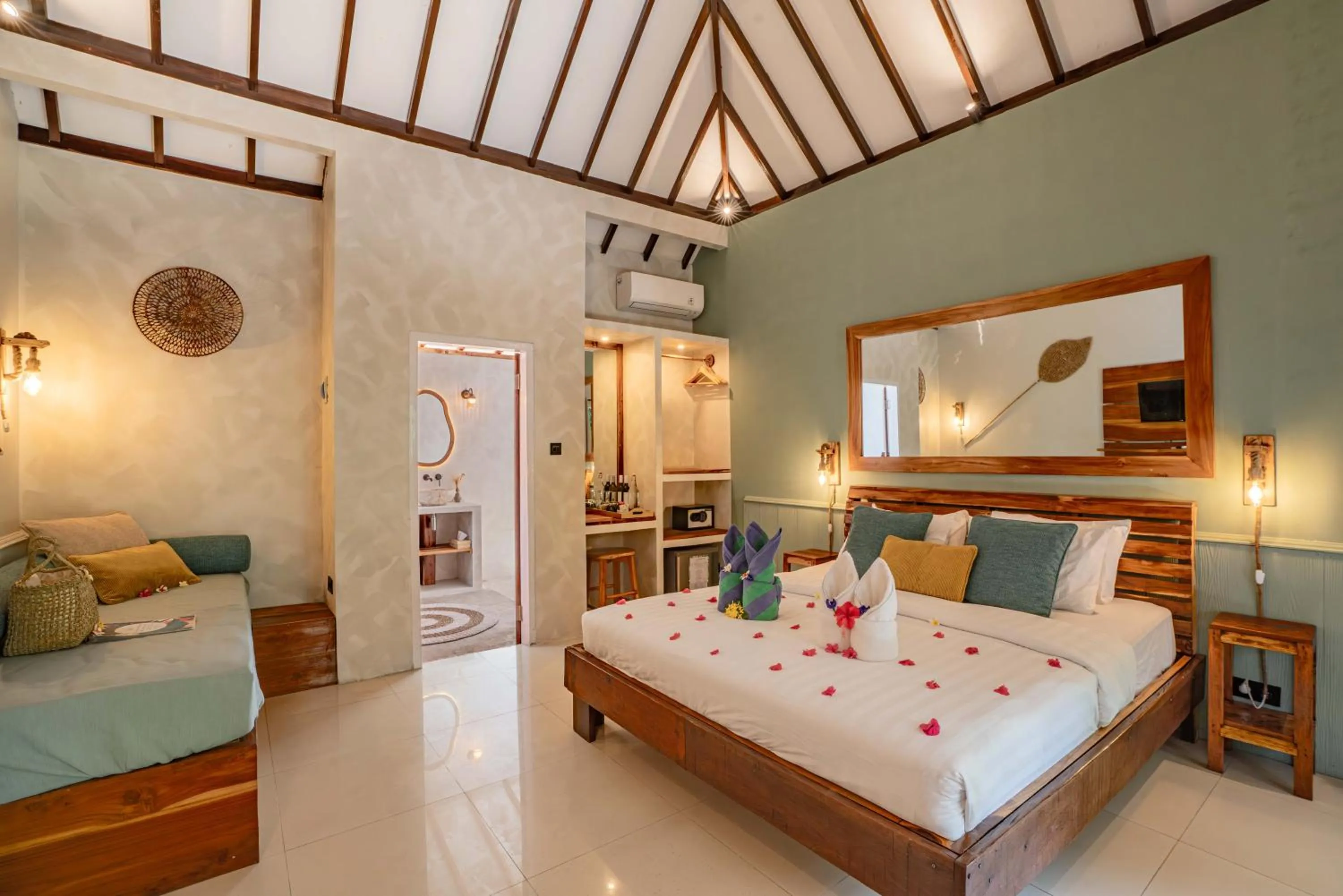 Bed in Bale Sampan Boutique Bungalows