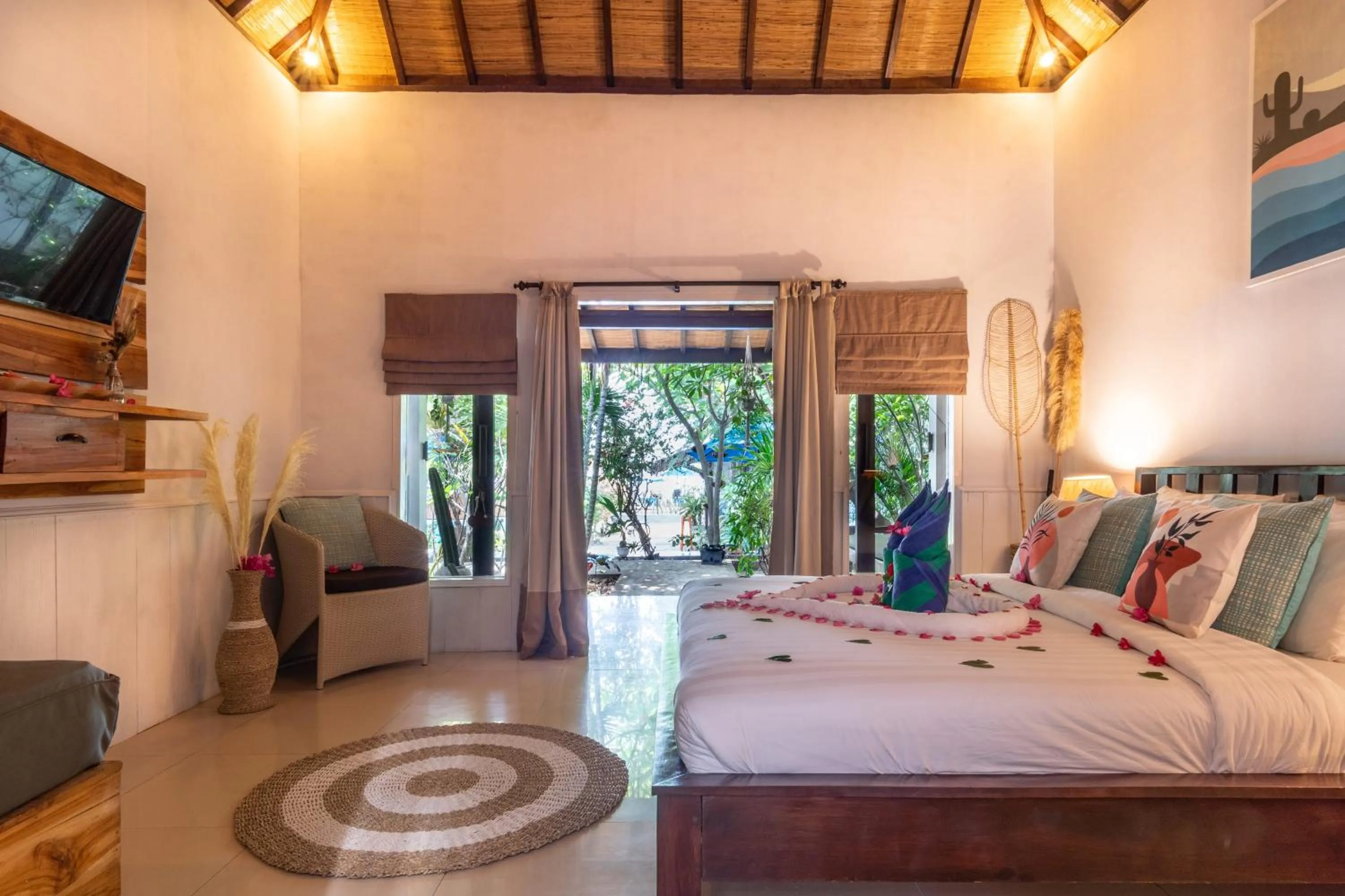 Bed in Bale Sampan Boutique Bungalows