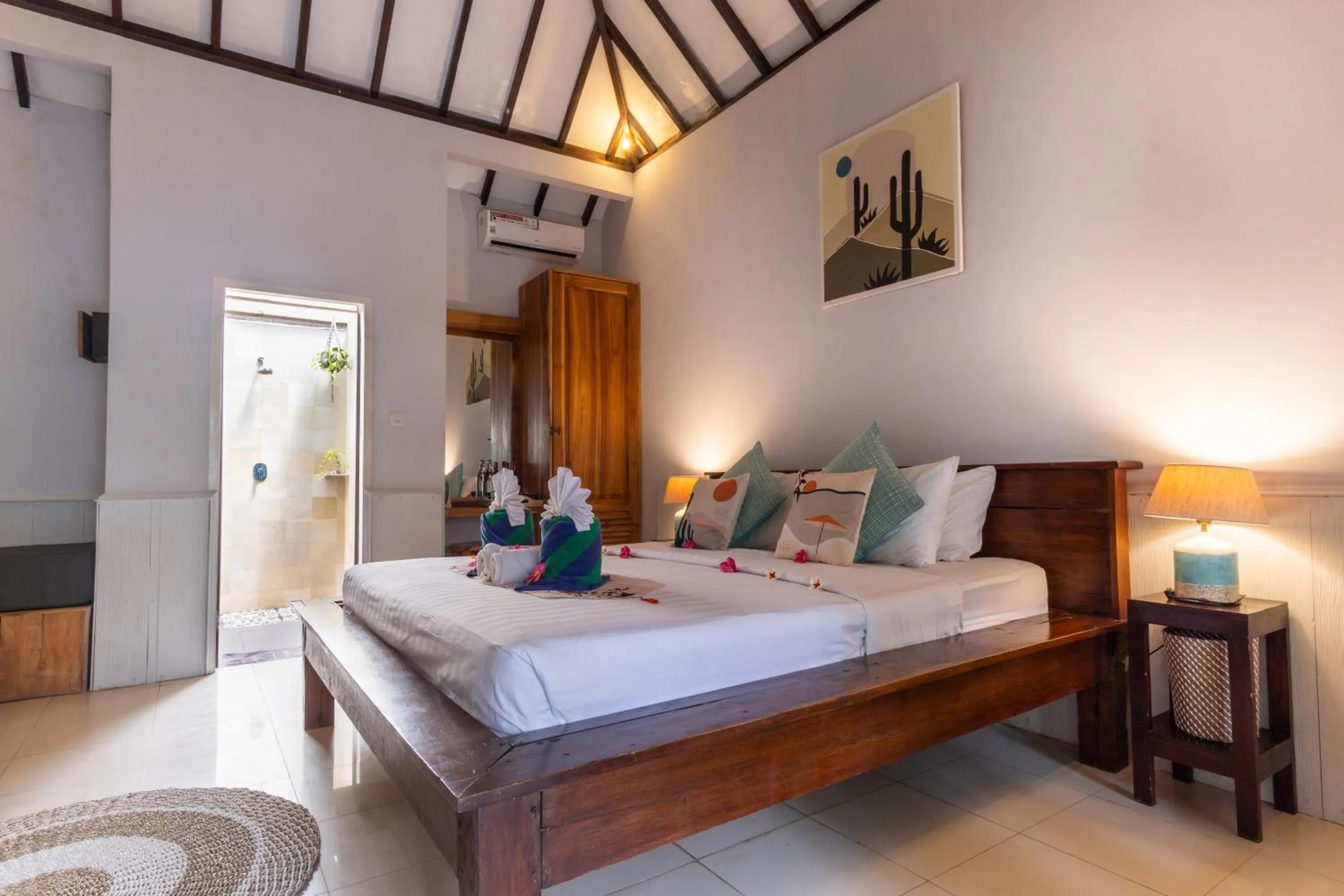 Bed in Bale Sampan Boutique Bungalows