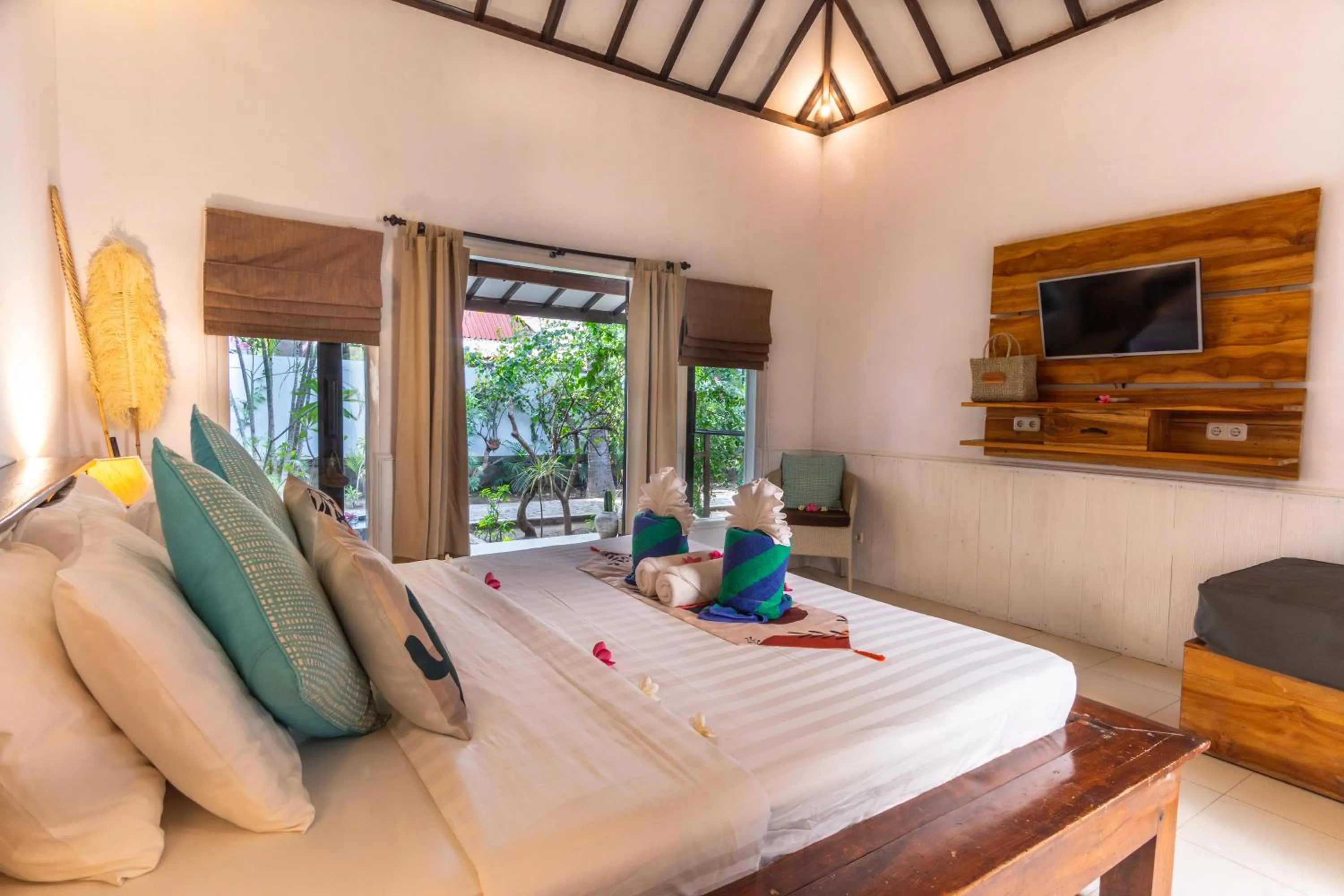 Bed in Bale Sampan Boutique Bungalows