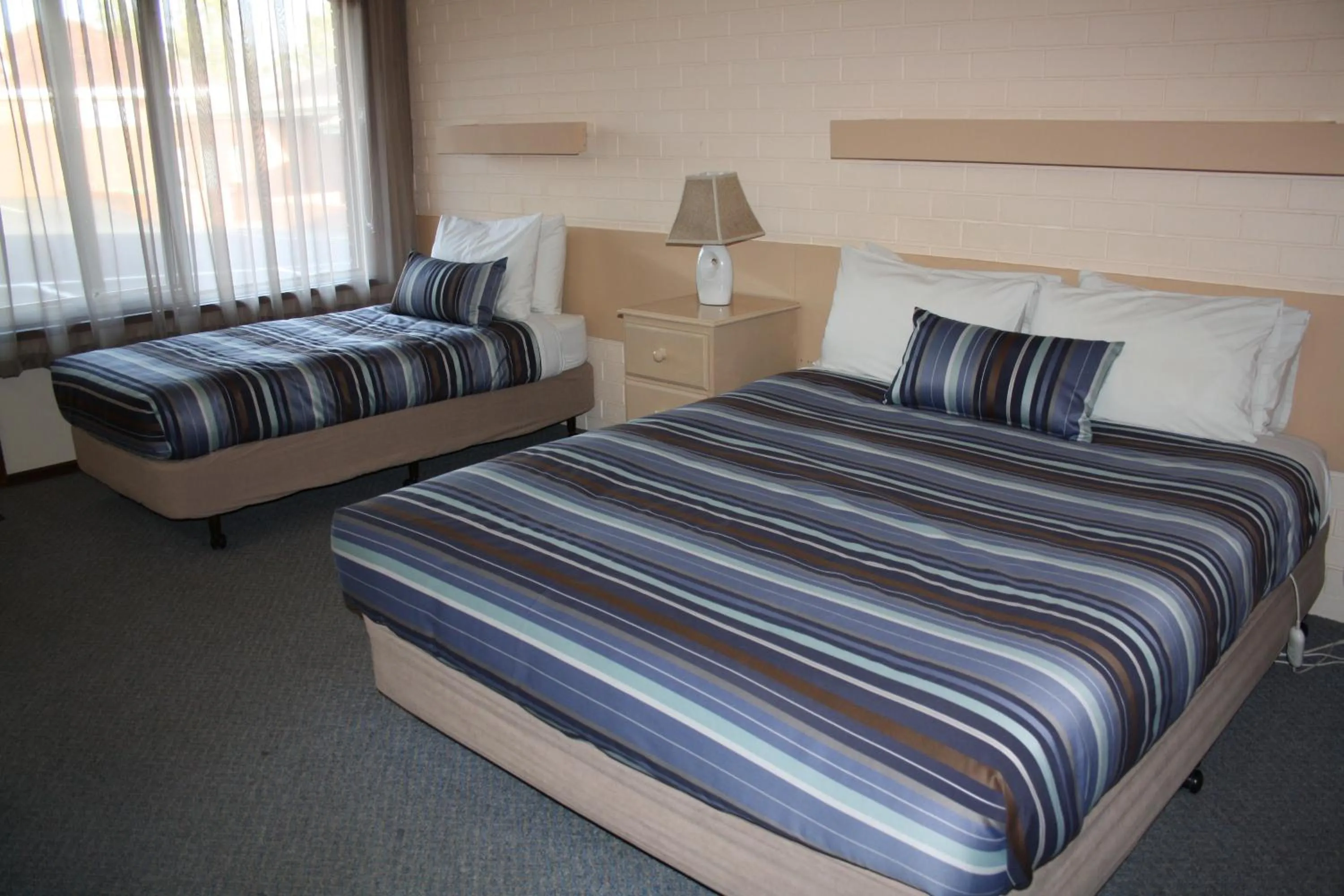 Bed in Raglan Motor Inn