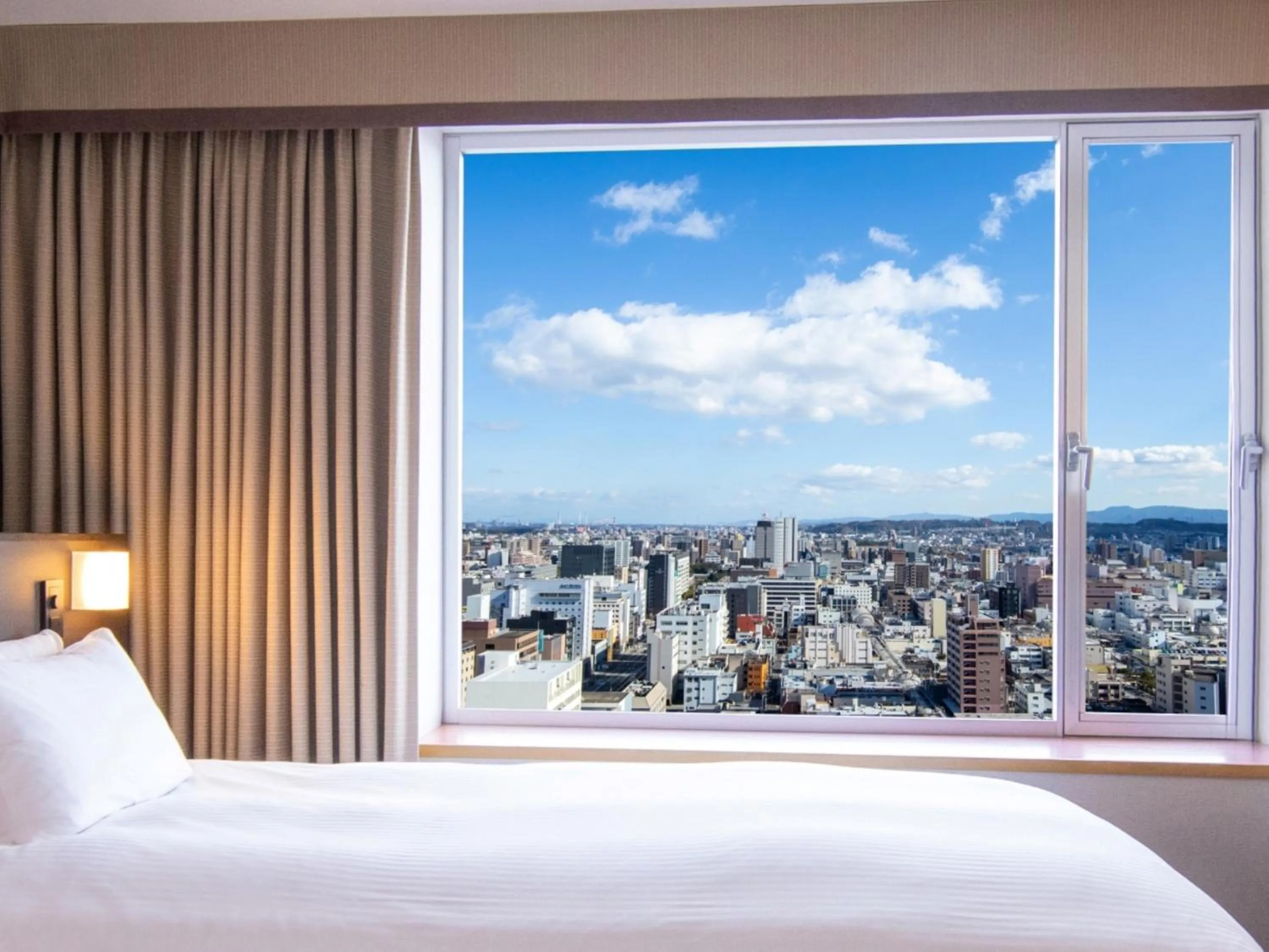 City view, Bed in Hotel Nikko Oita Oasis Tower