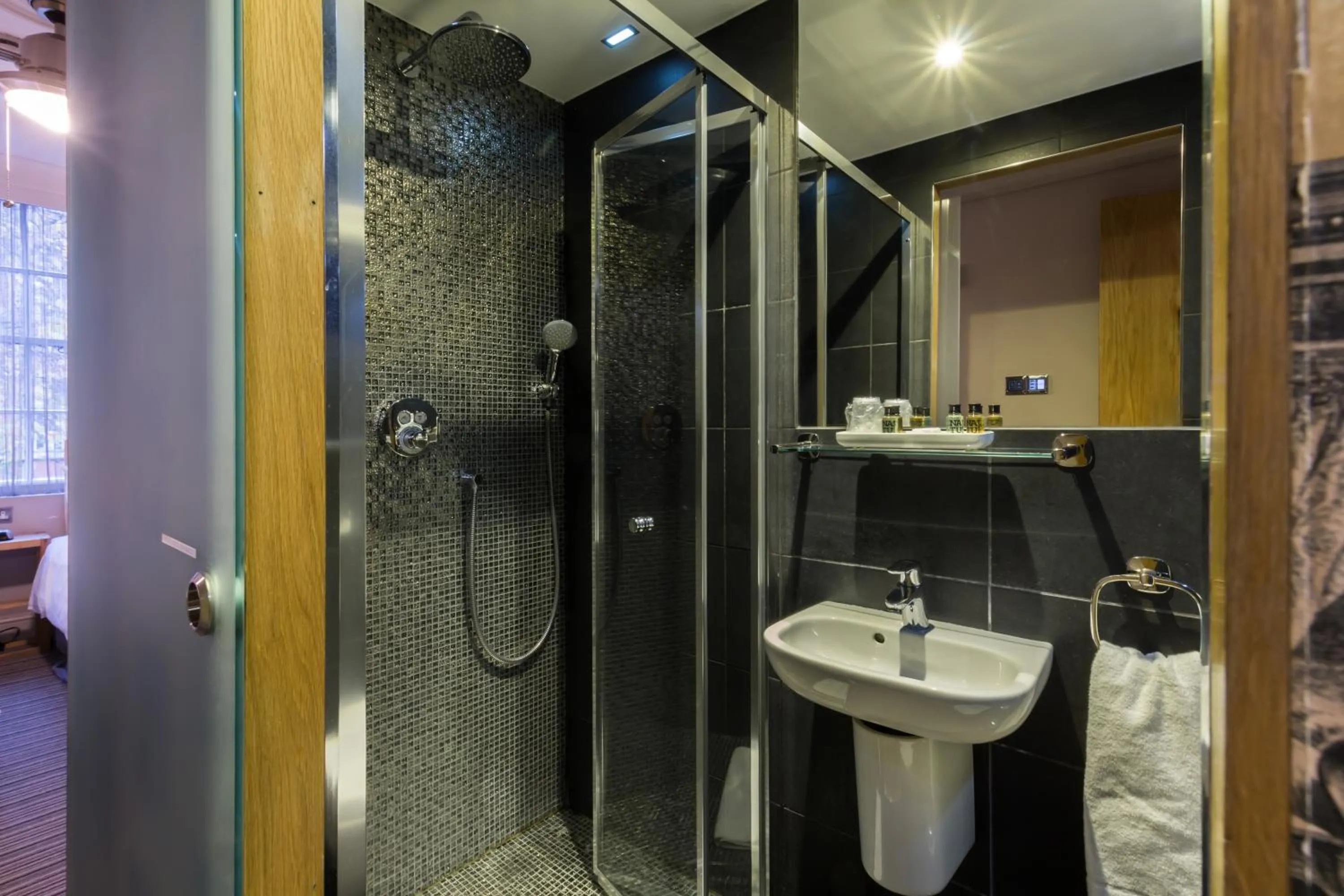 Bathroom in Arosfa Hotel London by Compass Hospitality