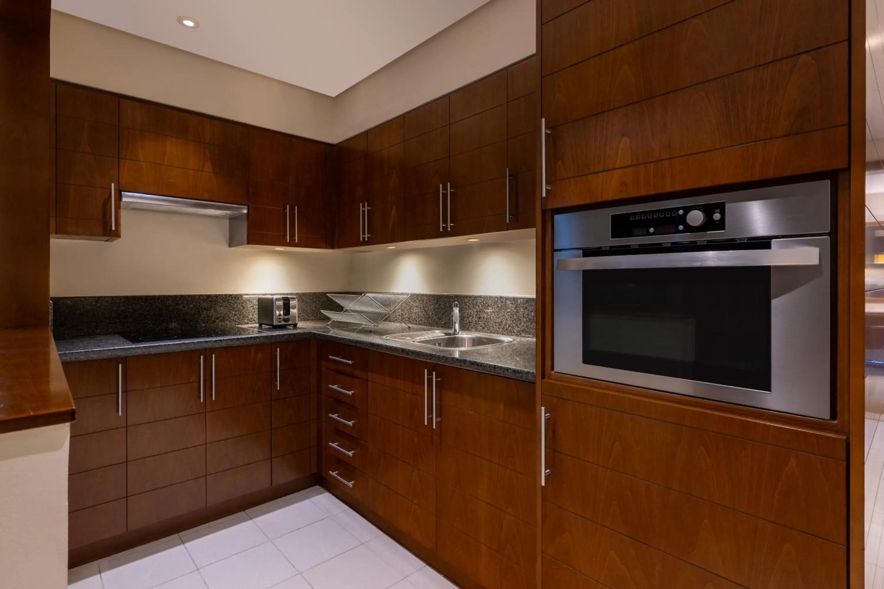 kitchen in Grand Millennium Al Wahda Executive Apartments