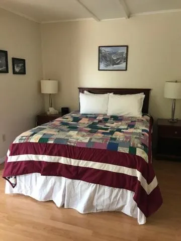 Bed in Lush's Cottages