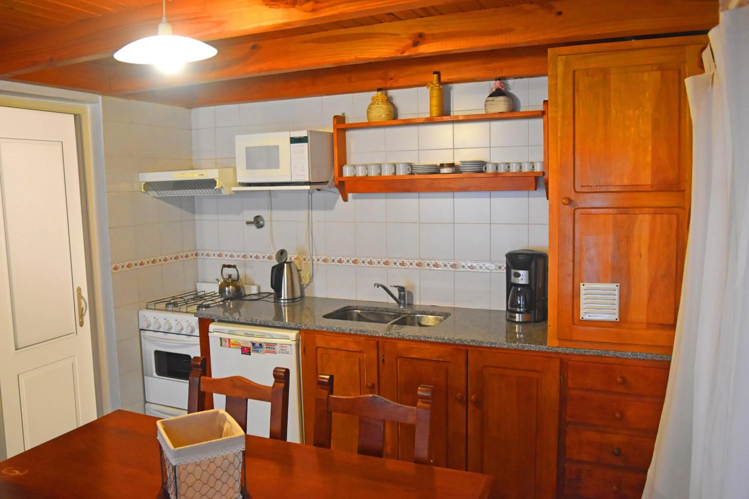 Kitchen or kitchenette in Cabañas Del Lacar