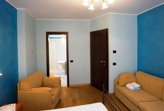 Seating area, Bed in Albergo Cecchin