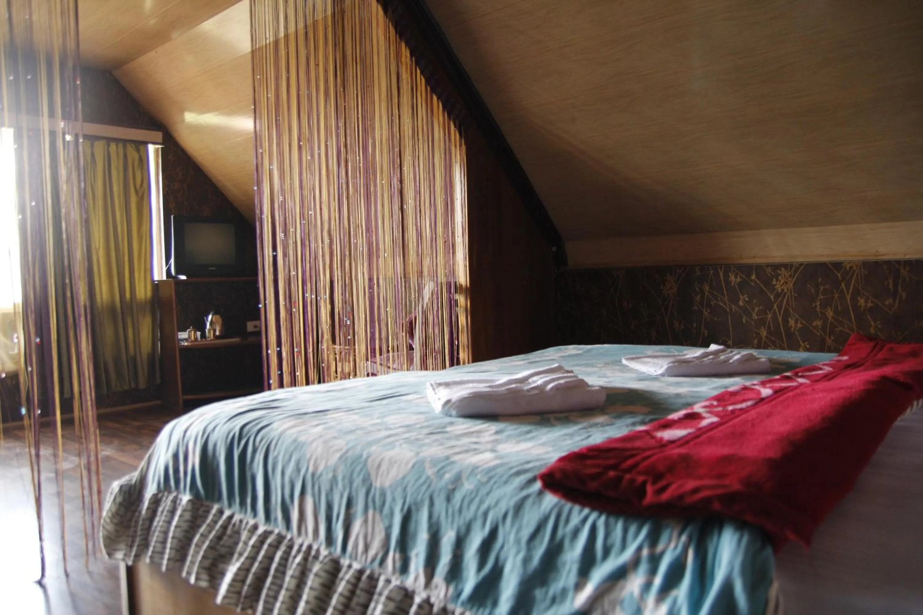 Bedroom, Bed in Mandarin Resort - Kaluk