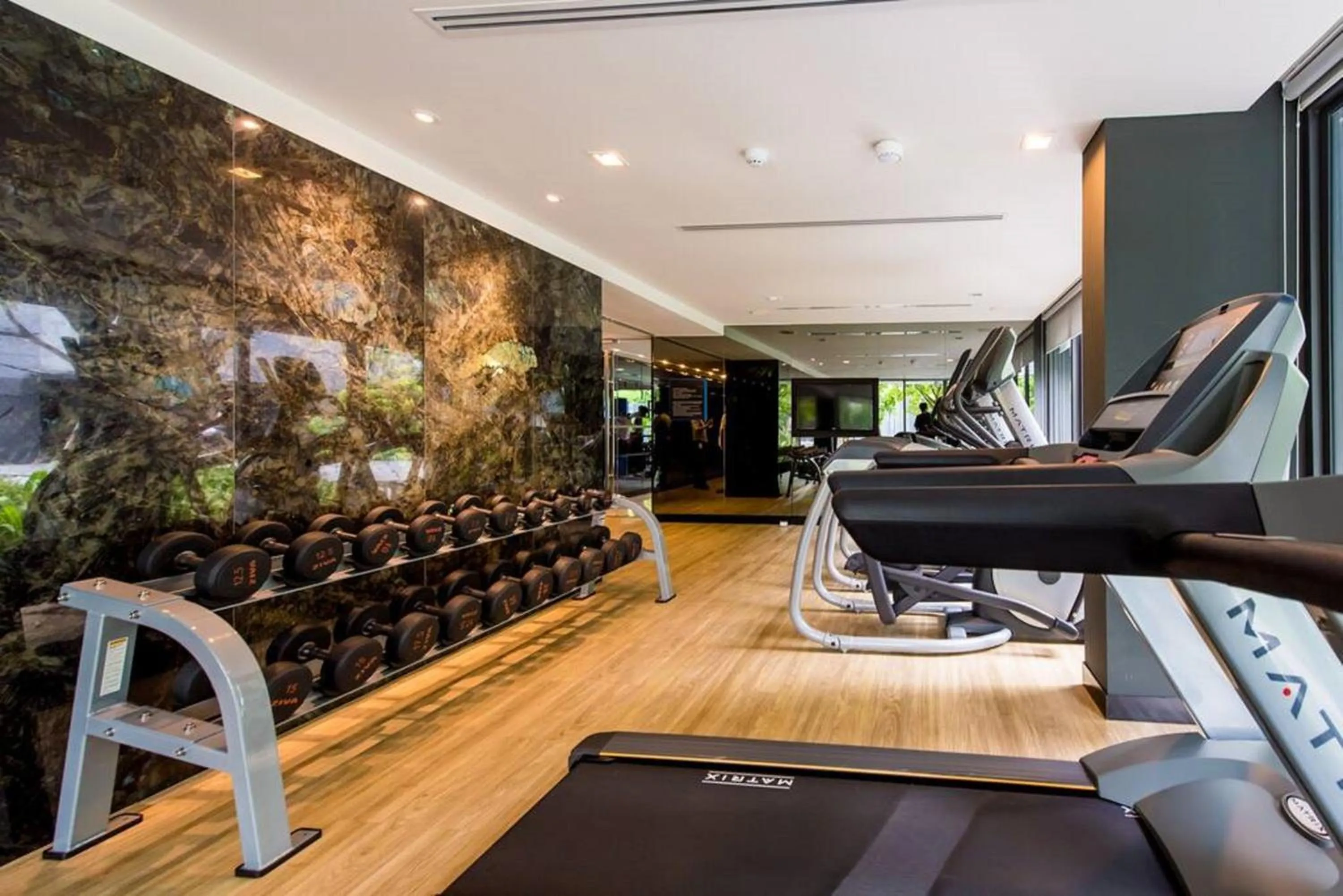 Fitness centre/facilities in The Deck Patong by VIP