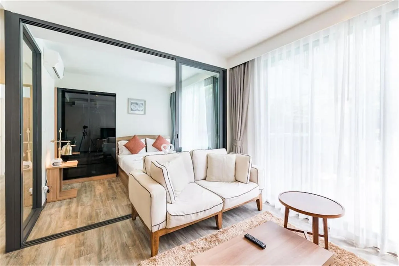 Living room, Bed in The Deck Patong by VIP