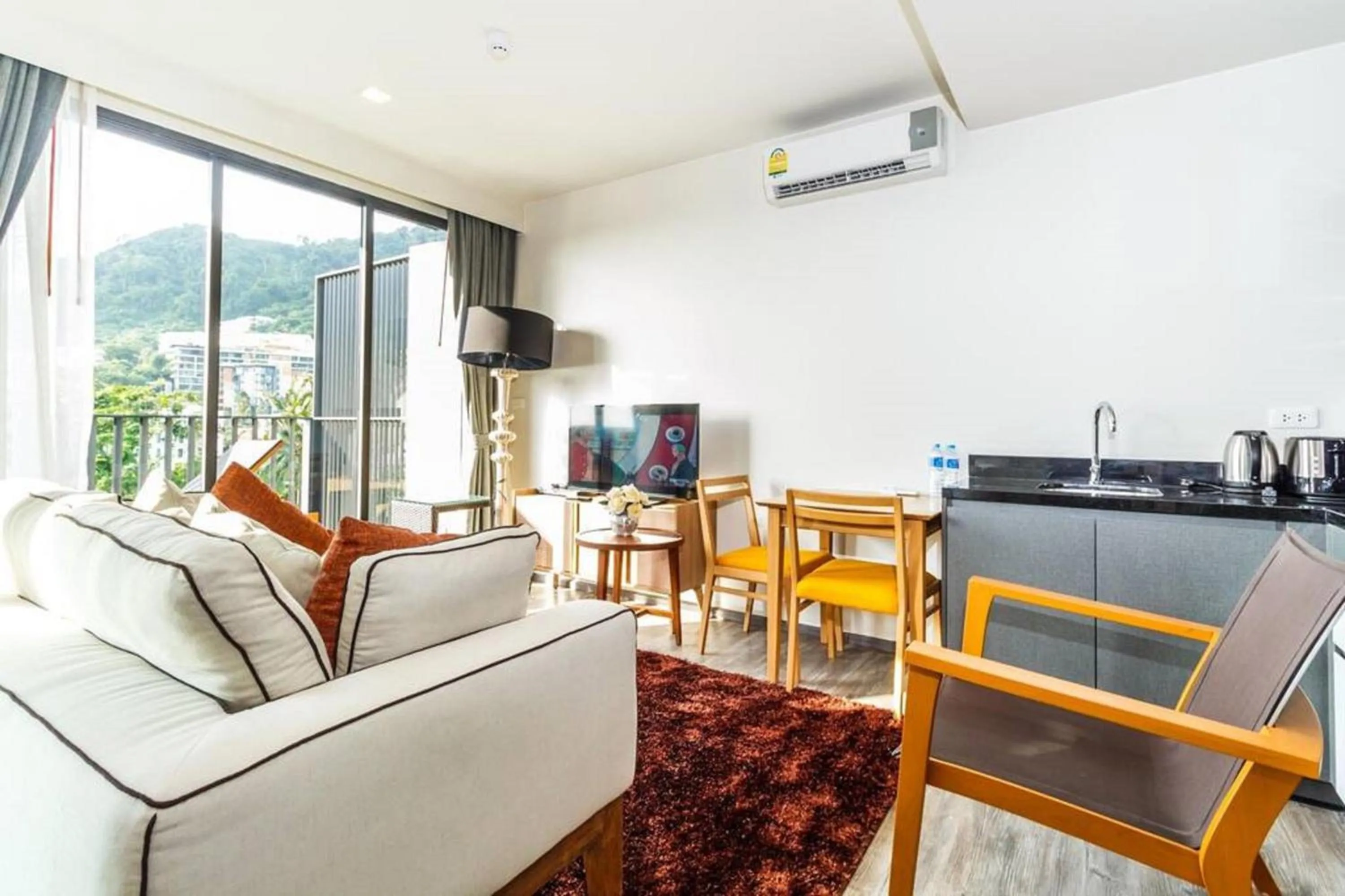 Living room in The Deck Patong by VIP