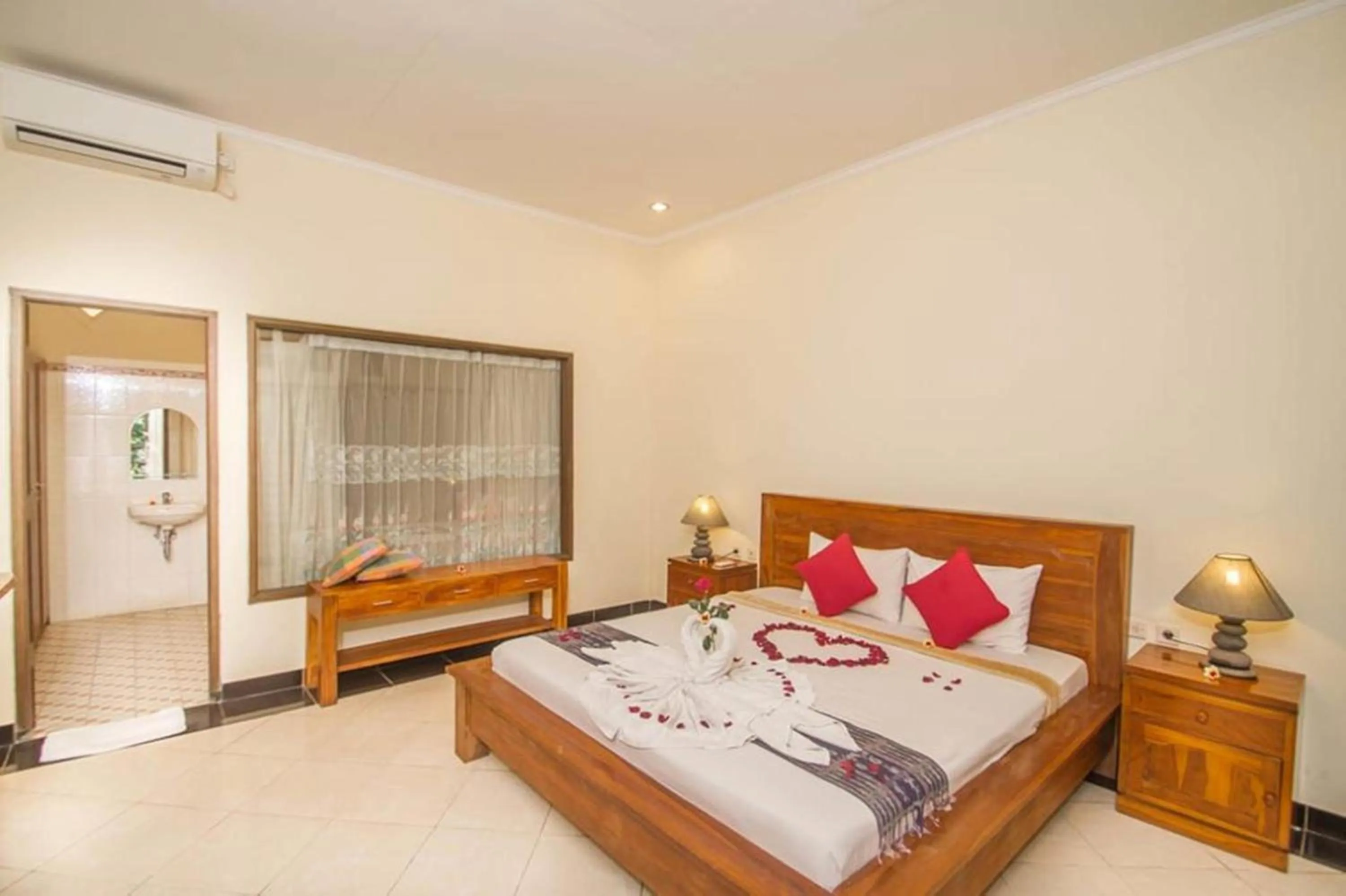 Bed in Adi Jaya Cottages Ubud Suites by EPS - CHSE Certified