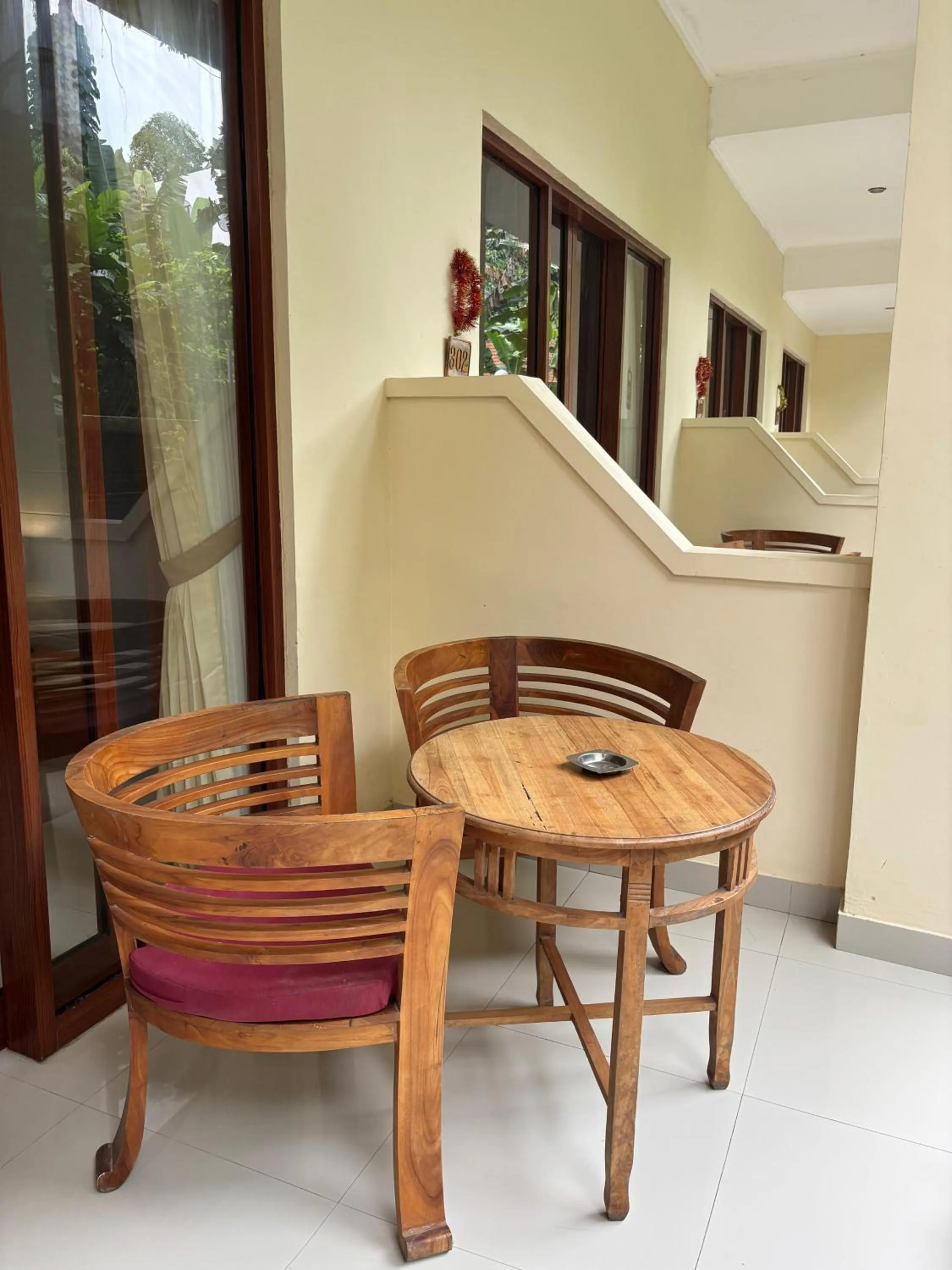 Seating area in Adi Jaya Cottages Ubud Suites by EPS - CHSE Certified
