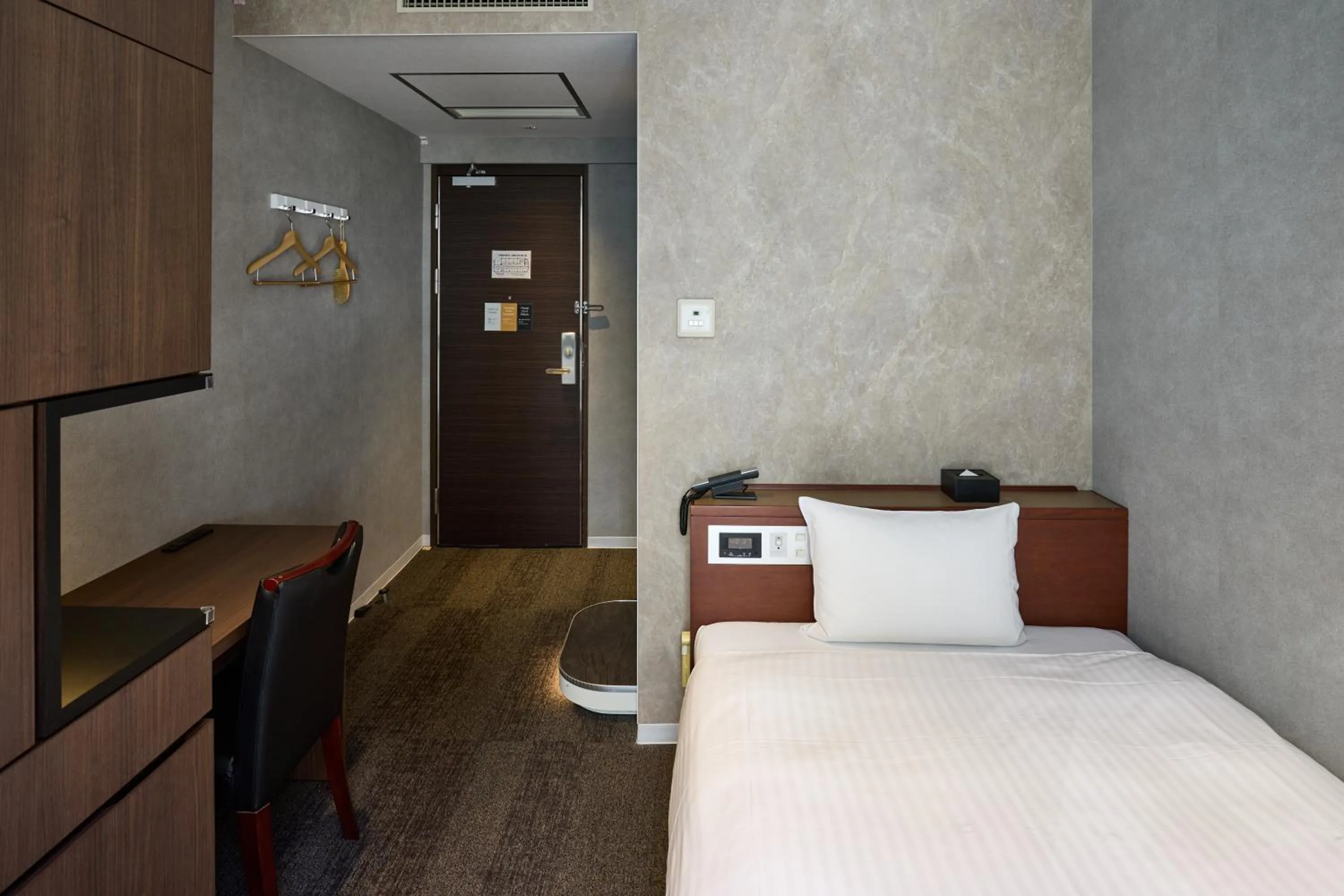 Bed in Ginza International Hotel