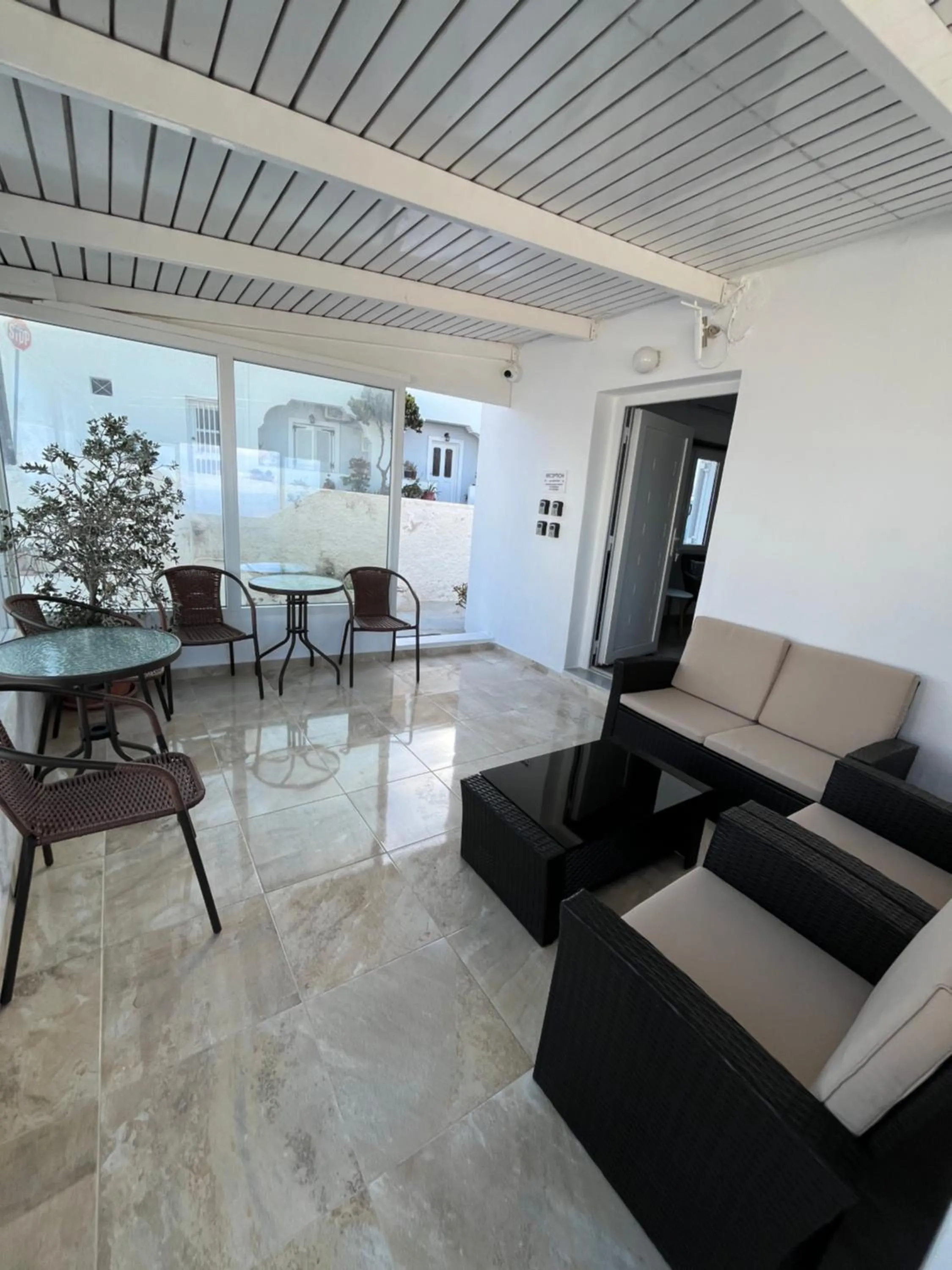 Communal lounge/ TV room in Stella Nomikou Apartments