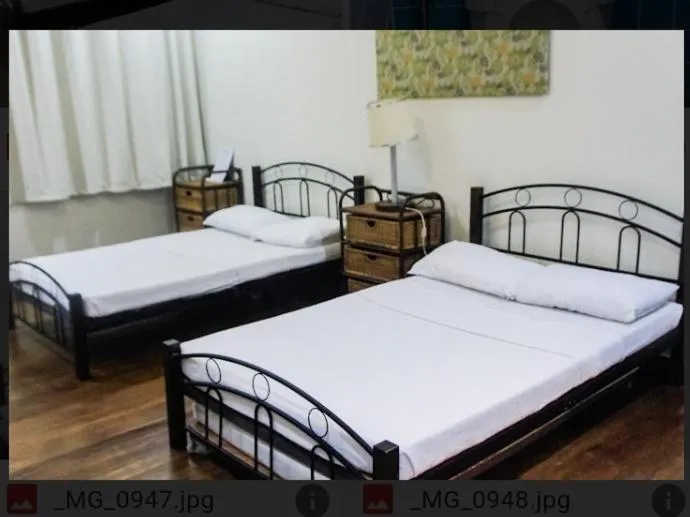 Bed in Balay 8 Suites