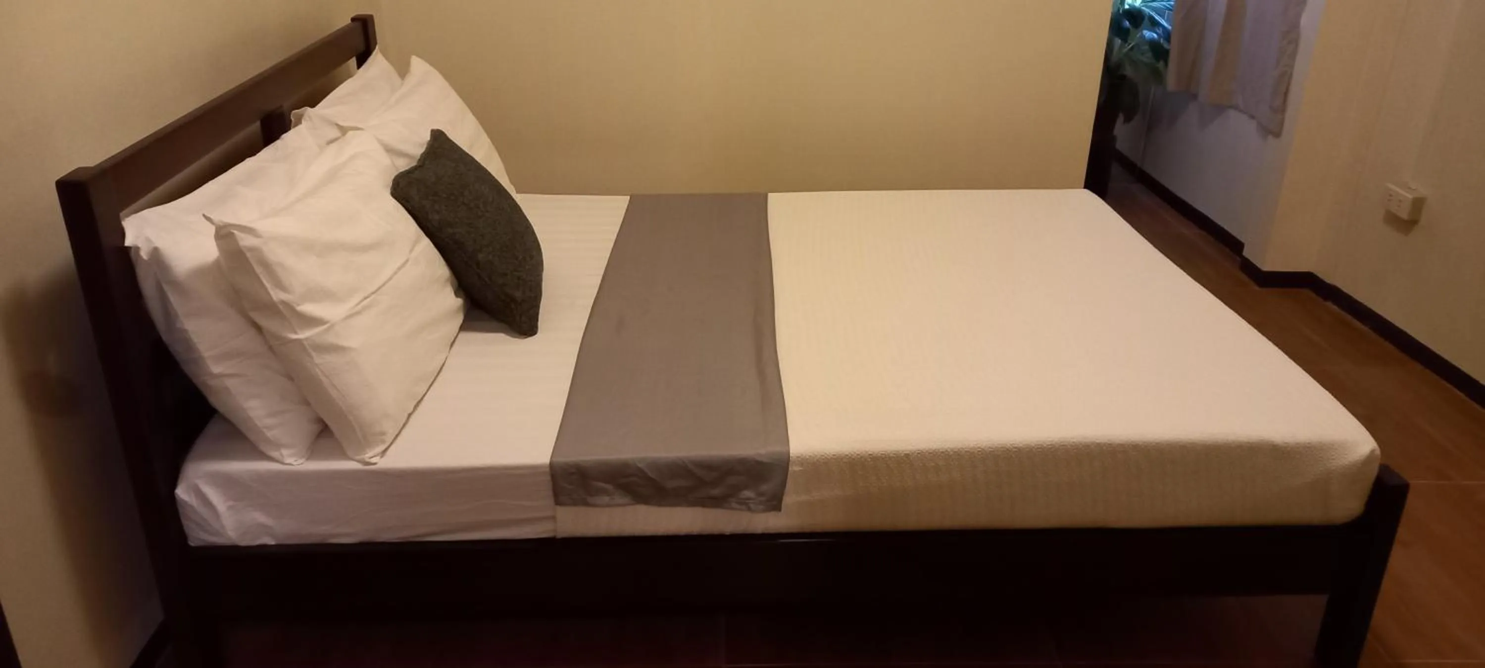 Bed in Balay 8 Suites