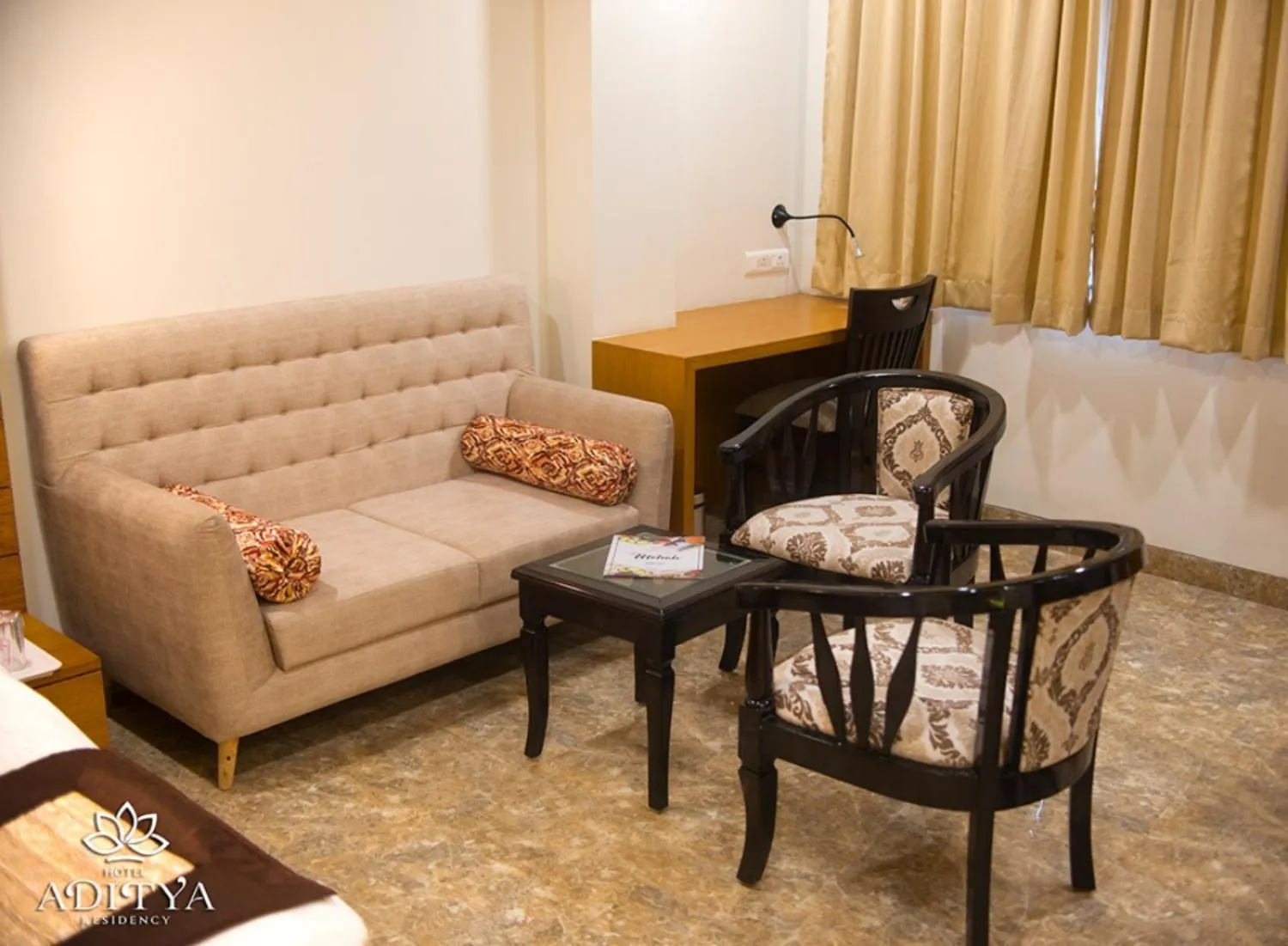 Seating area in Hotel Aditya Residency