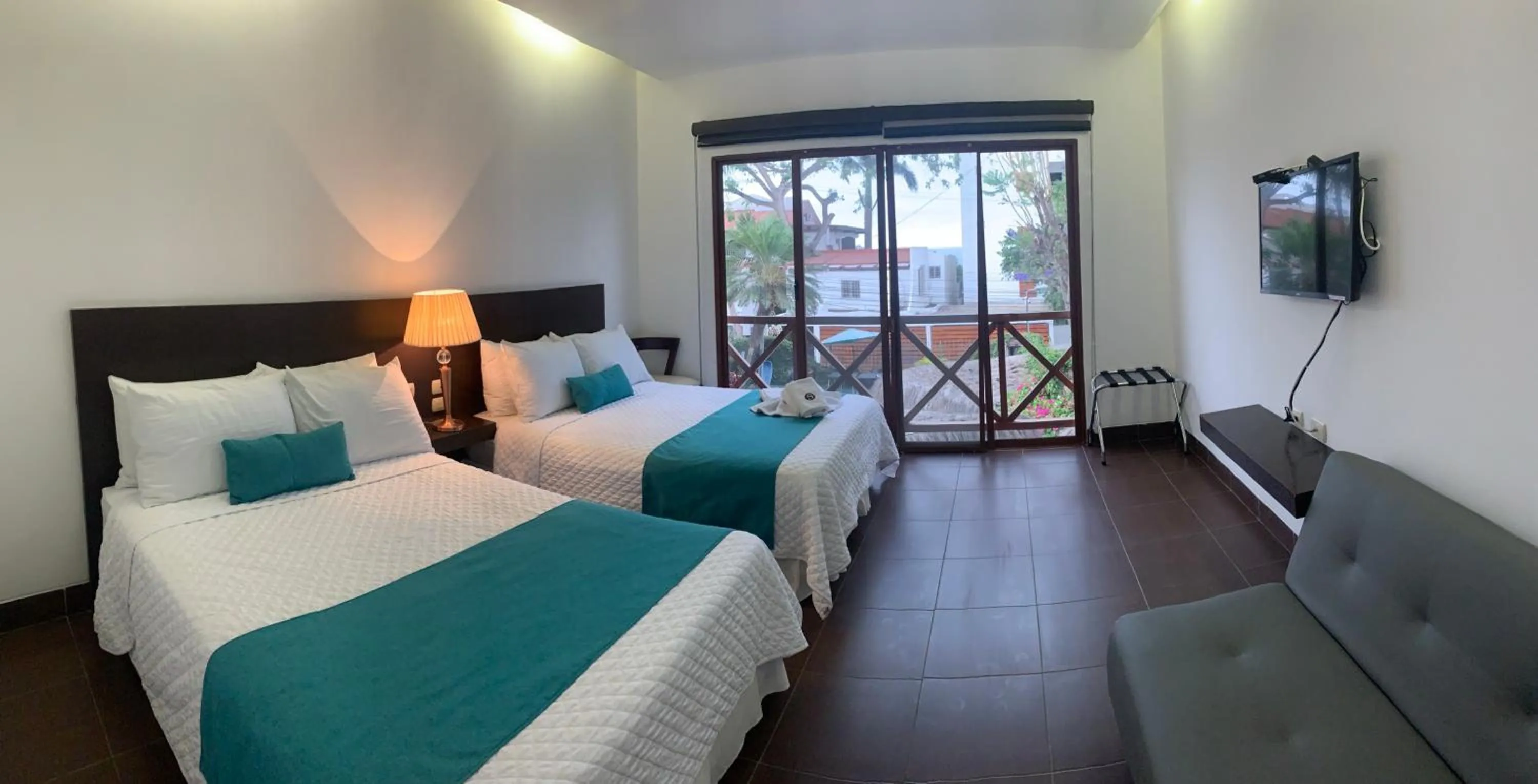 Photo of the whole room, Bed in Hosteria Punta Blanca
