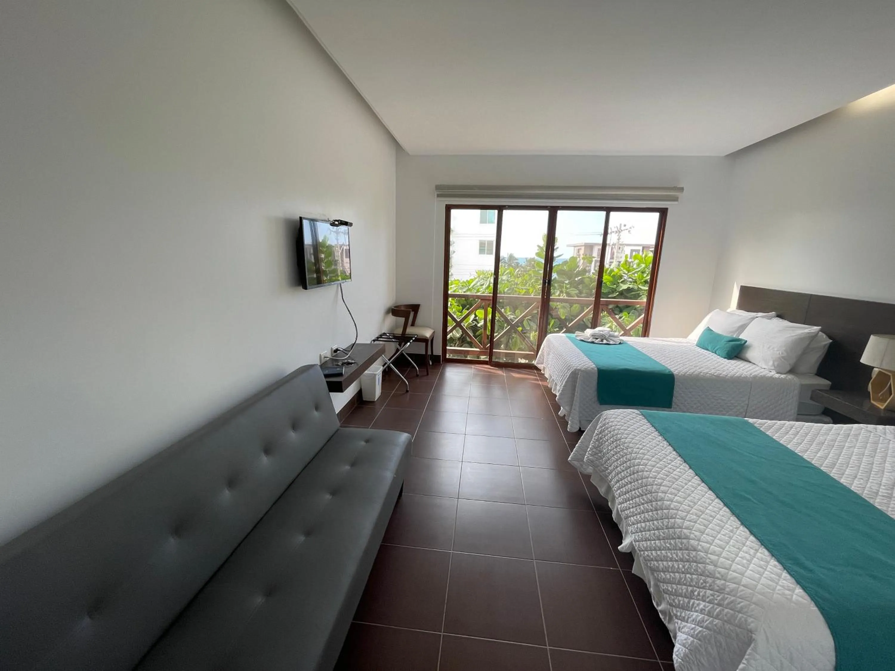 Photo of the whole room, Bed in Hosteria Punta Blanca